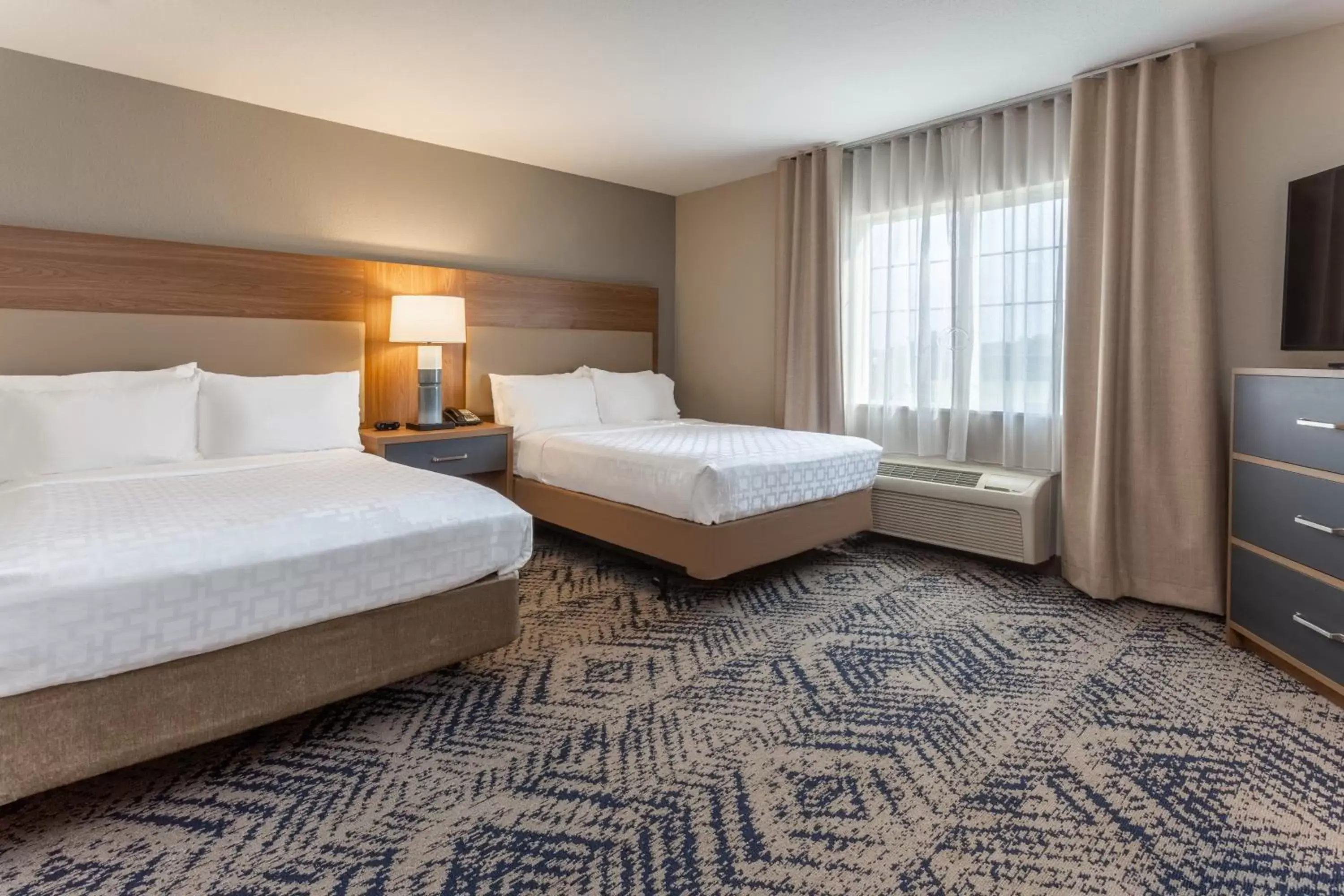 Photo of the whole room, Bed in Candlewood Suites Ofallon, Il - St. Louis Area, an IHG Hotel
