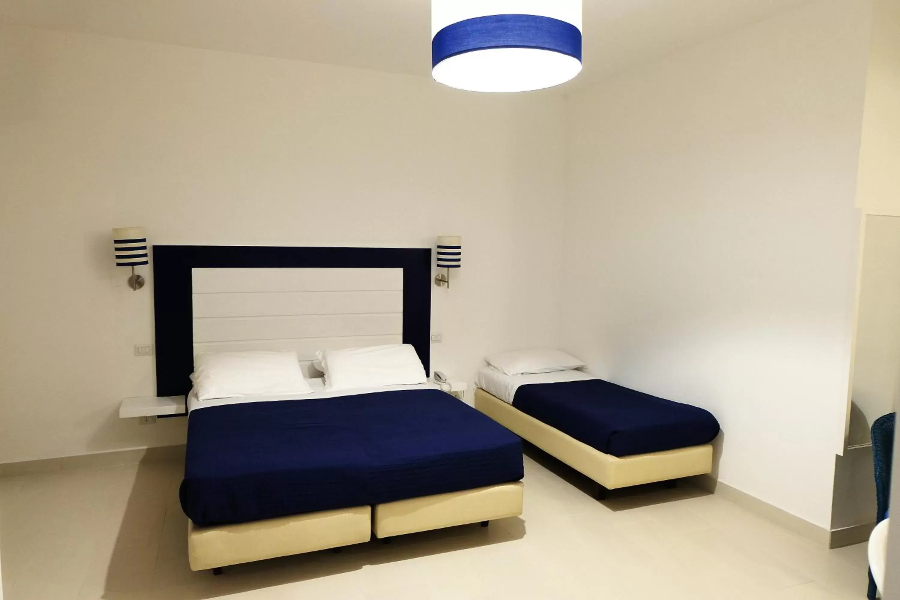 Bed in Hotel Baia Di Puolo Bed in Hotel Baia Di Puolo