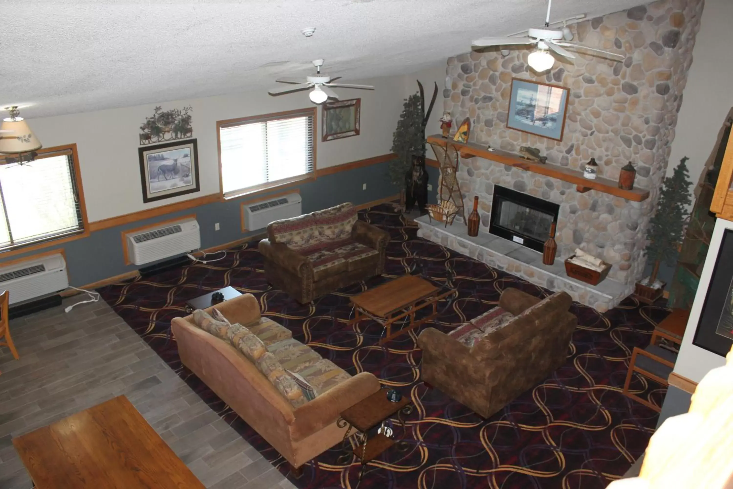 Living room in AmericInn by Wyndham West Burlington Living room in AmericInn by Wyndham West Burlington