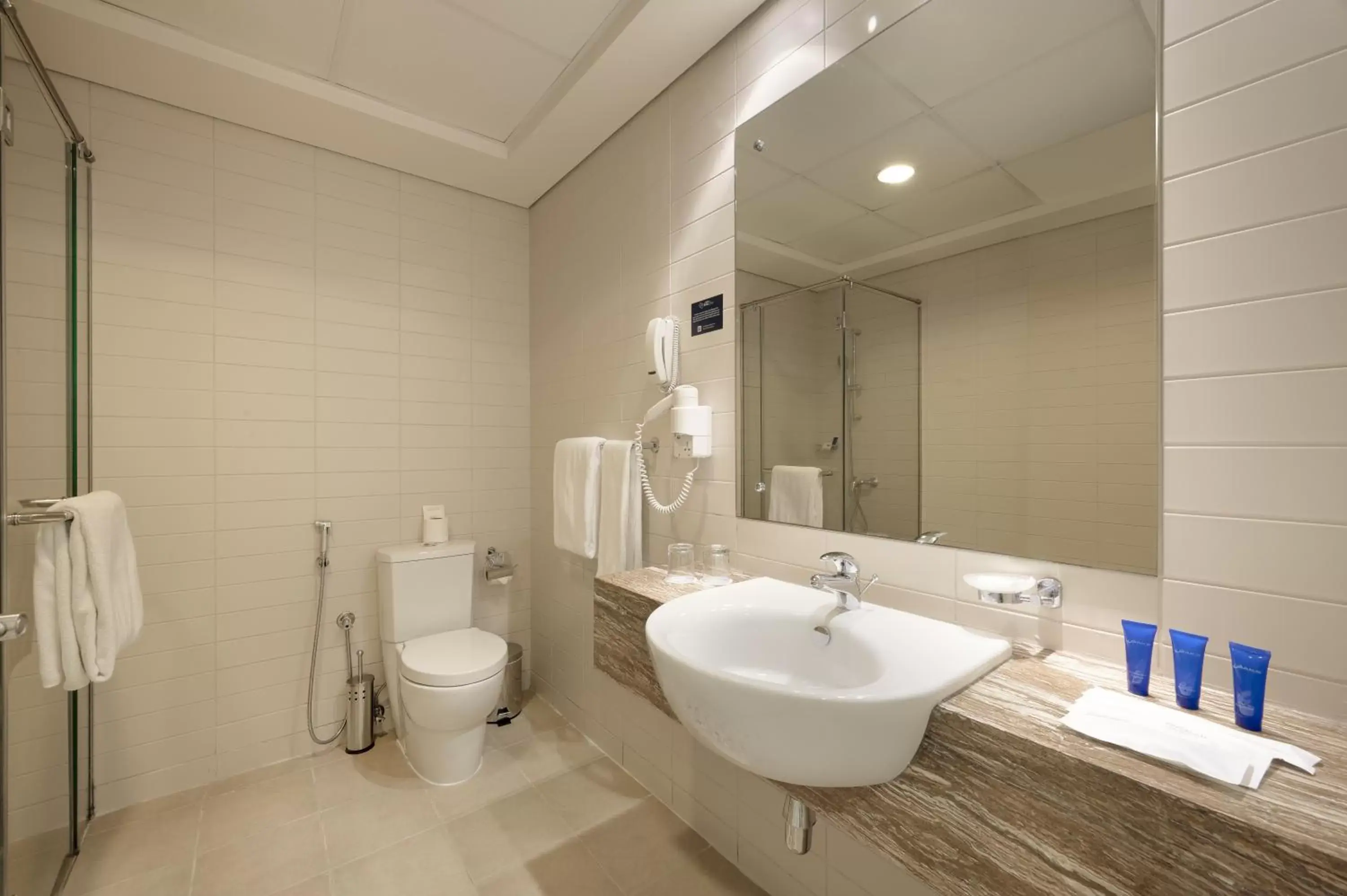 Bathroom in Oaks Liwa Heights Hotel Suites