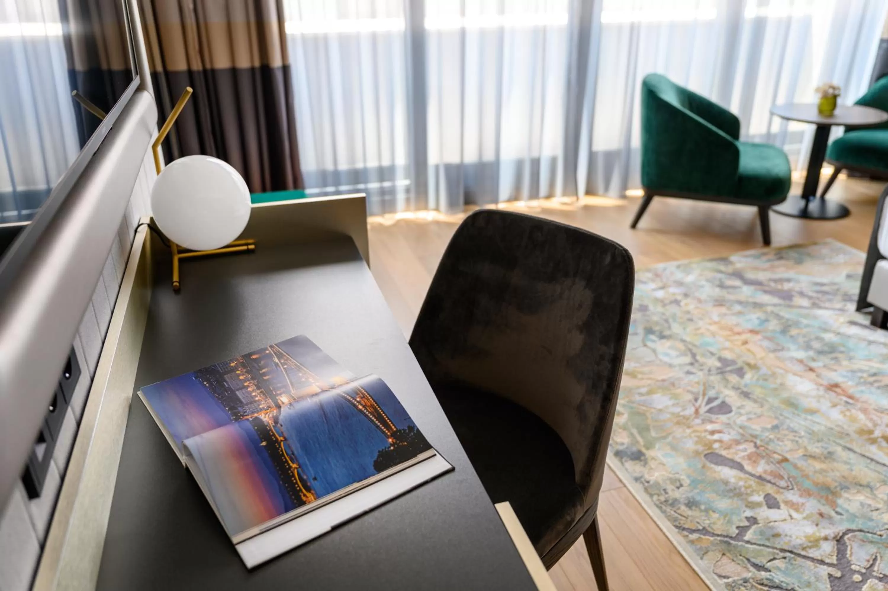 Seating area in Emerald Downtown Luxury Suites by Continental Group