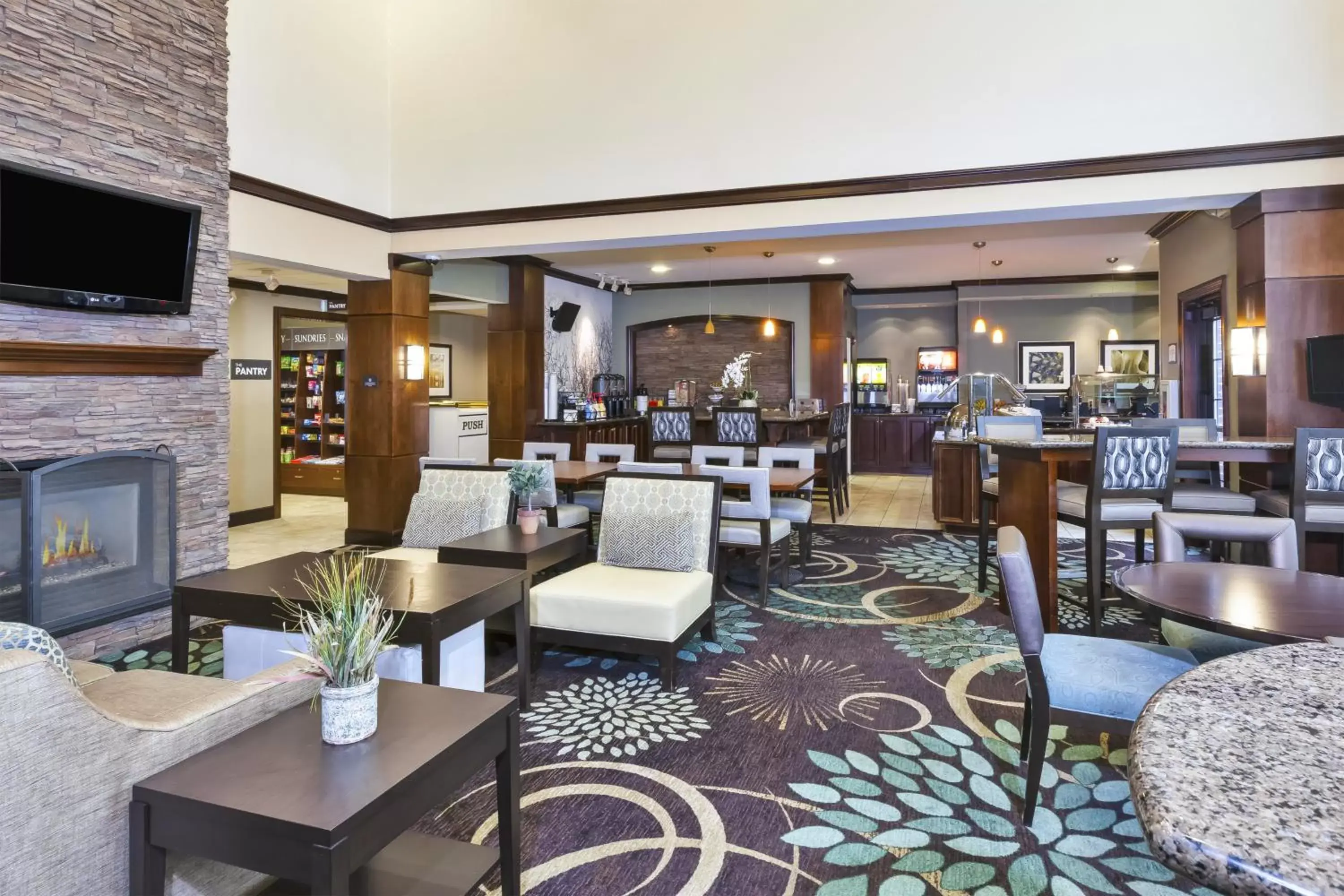 Lobby or reception, Restaurant/Places to Eat in Staybridge Suites Lansing-Okemos, an IHG Hotel