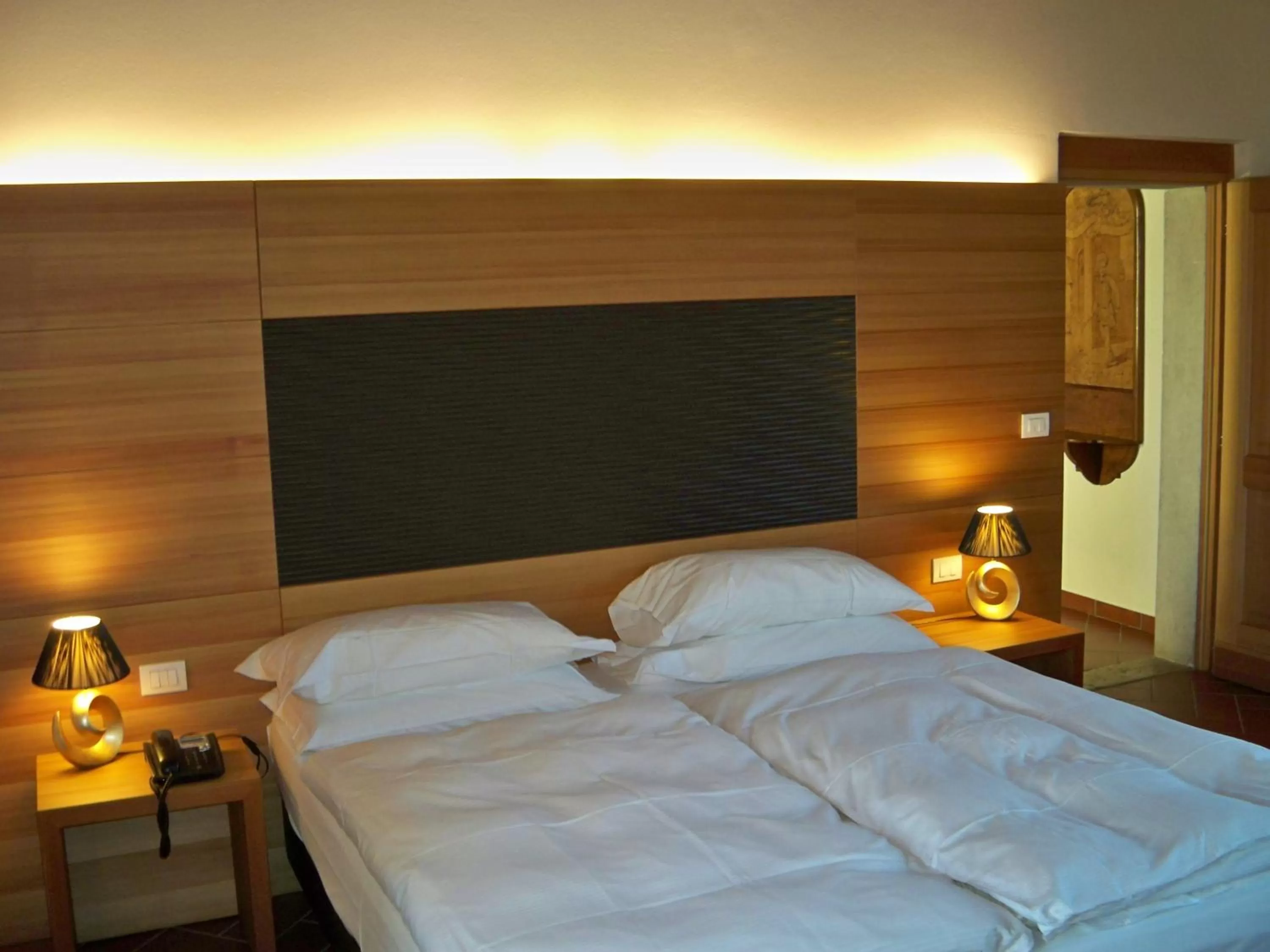 Bed in Relais Palazzo Lodron