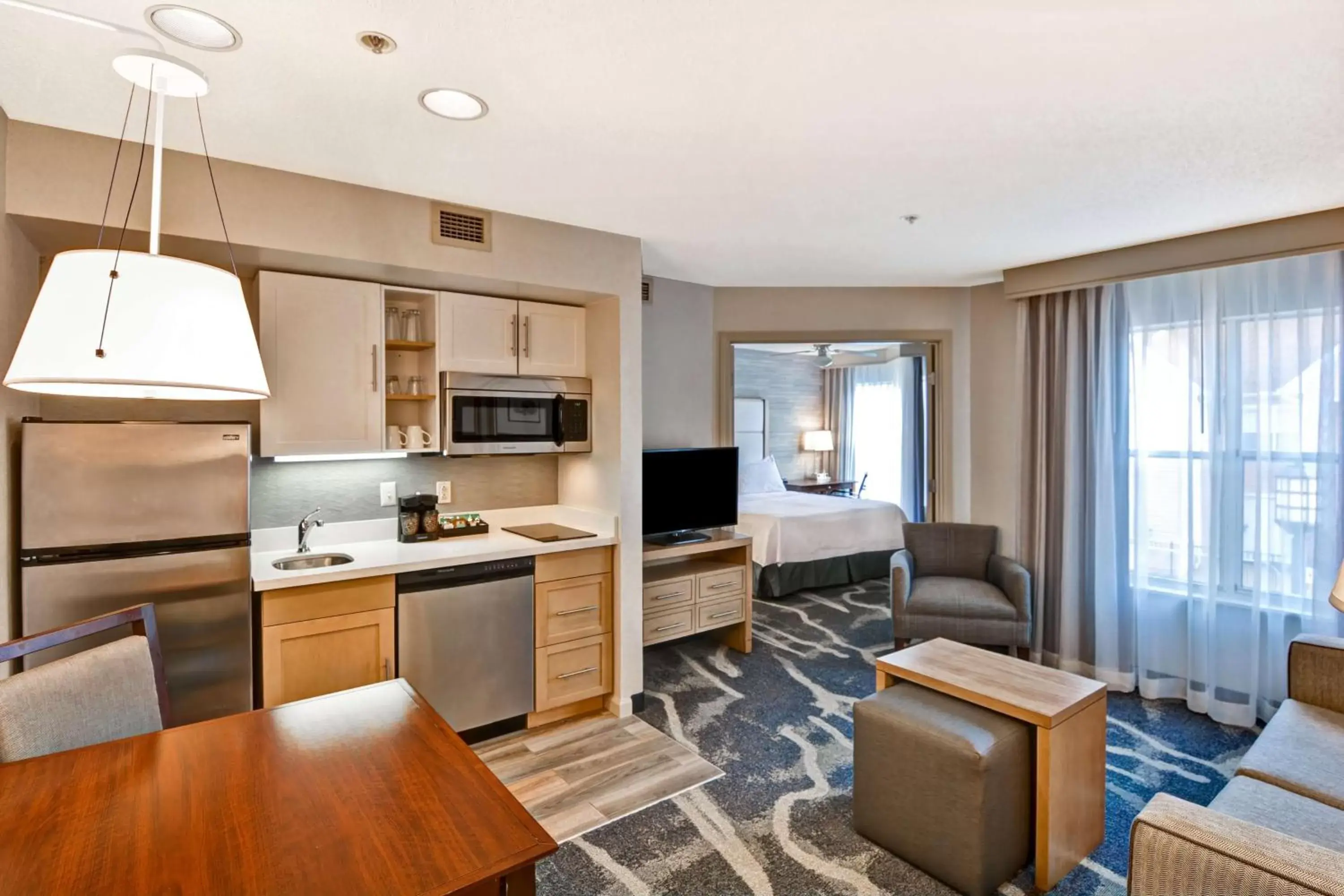Bedroom, Kitchen/Kitchenette in Homewood Suites Hartford/Windsor Locks