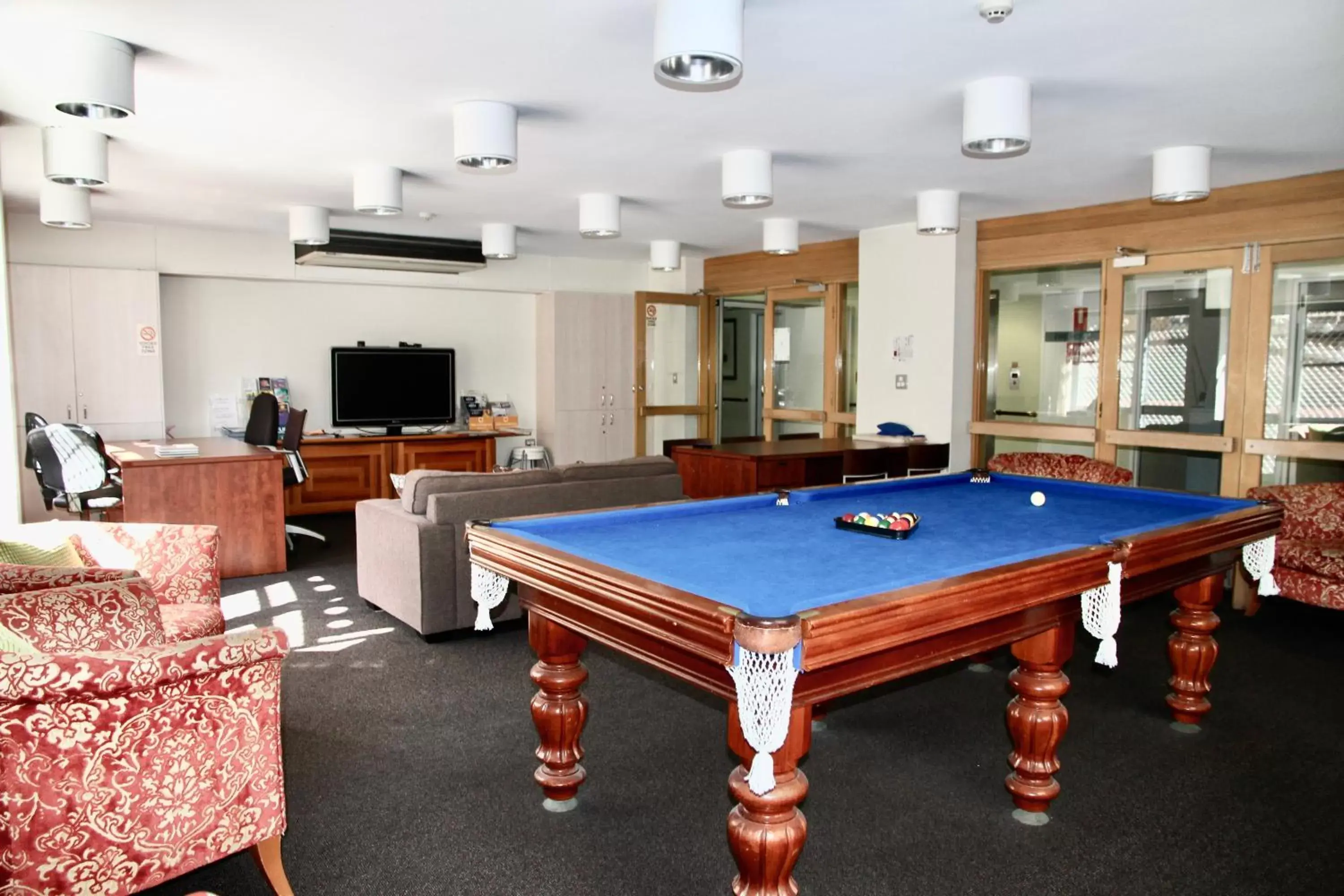 Communal lounge/ TV room, Billiards in Mariners Court Hotel Sydney