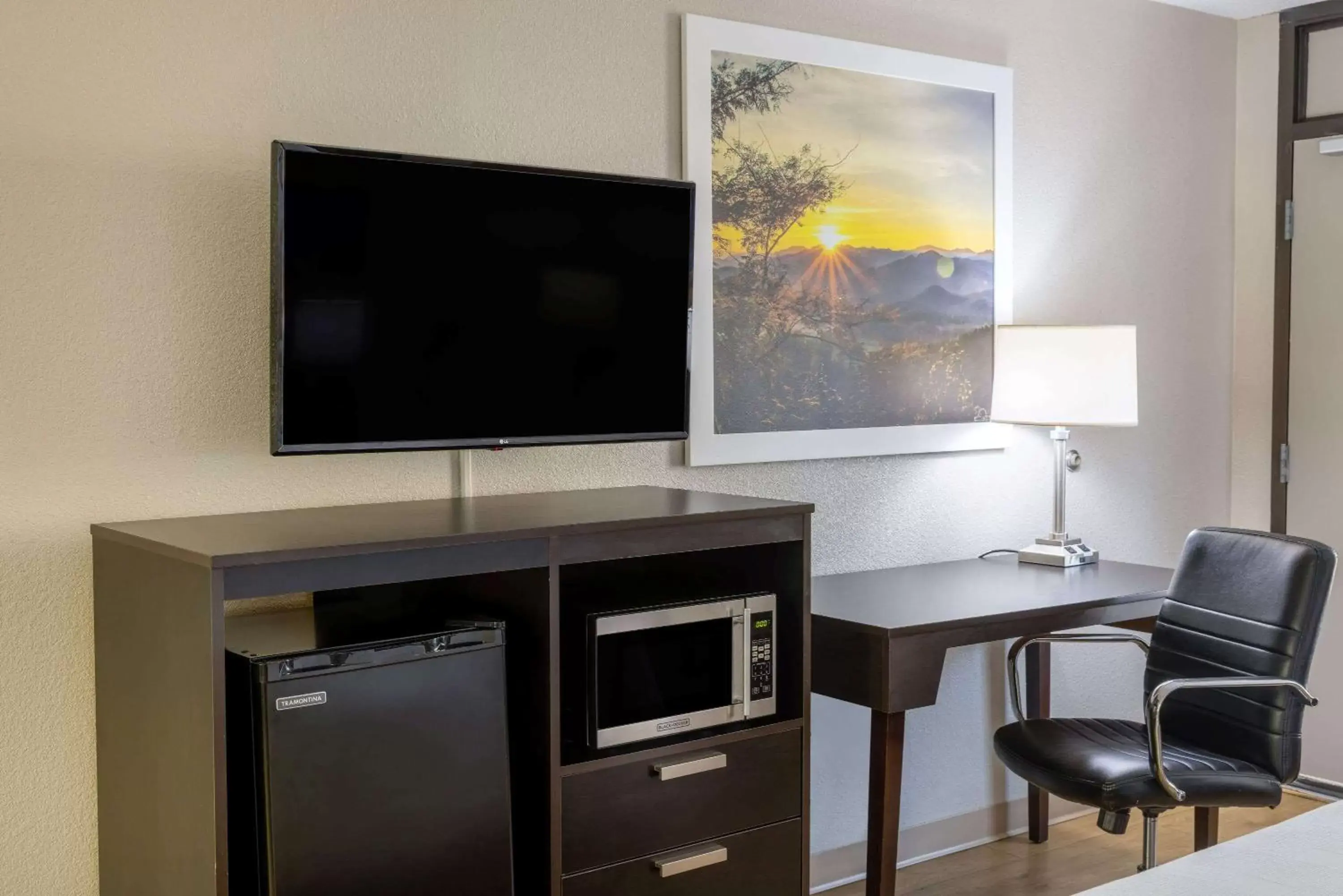 Photo of the whole room, TV/Entertainment Center in Days Inn by Wyndham Raleigh Midtown