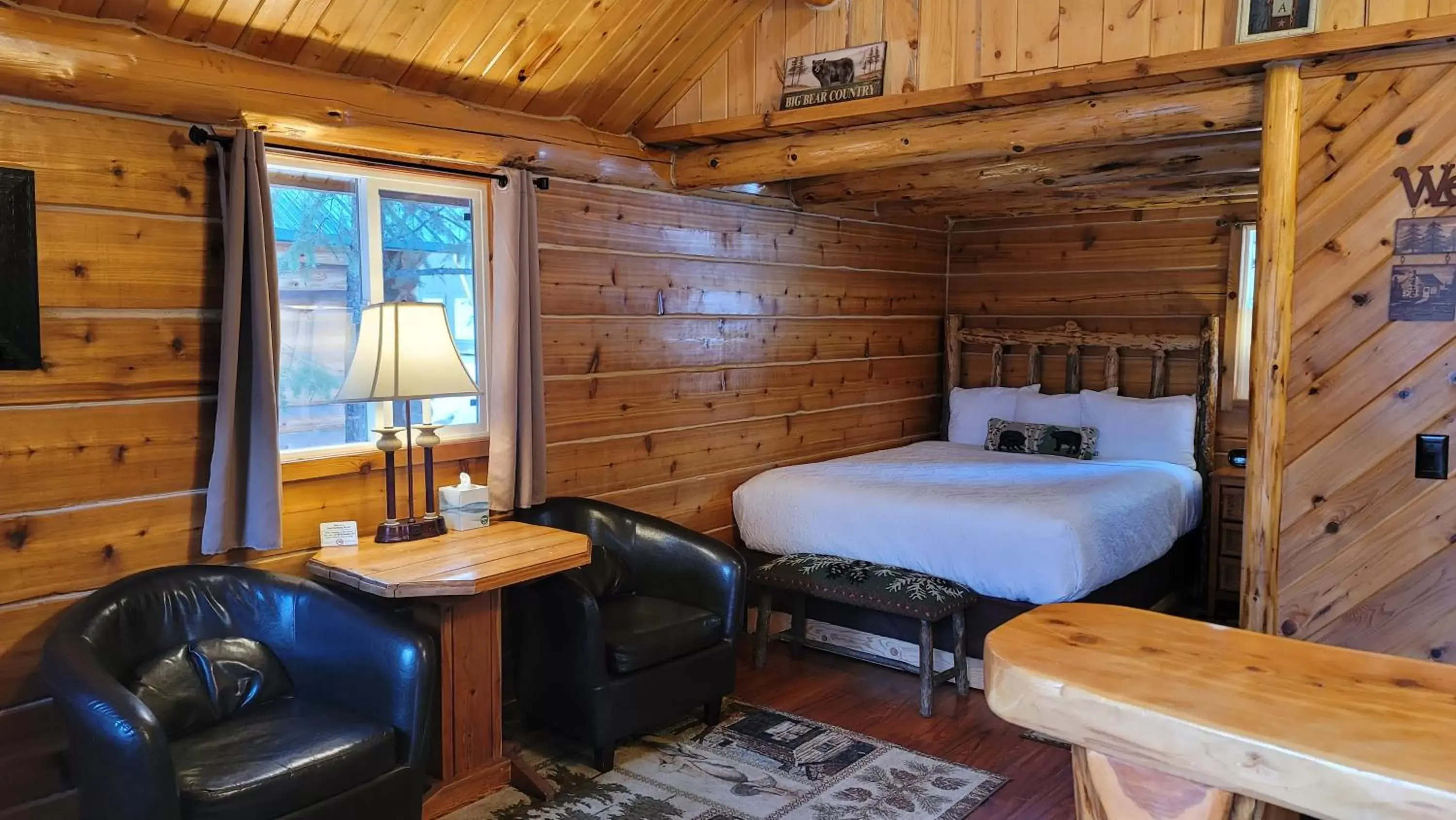 Bed in Riverfront Motel & Cabins