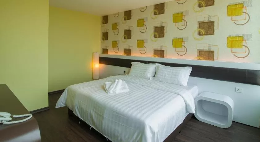 Bed in Riverfront Boutique Hotel