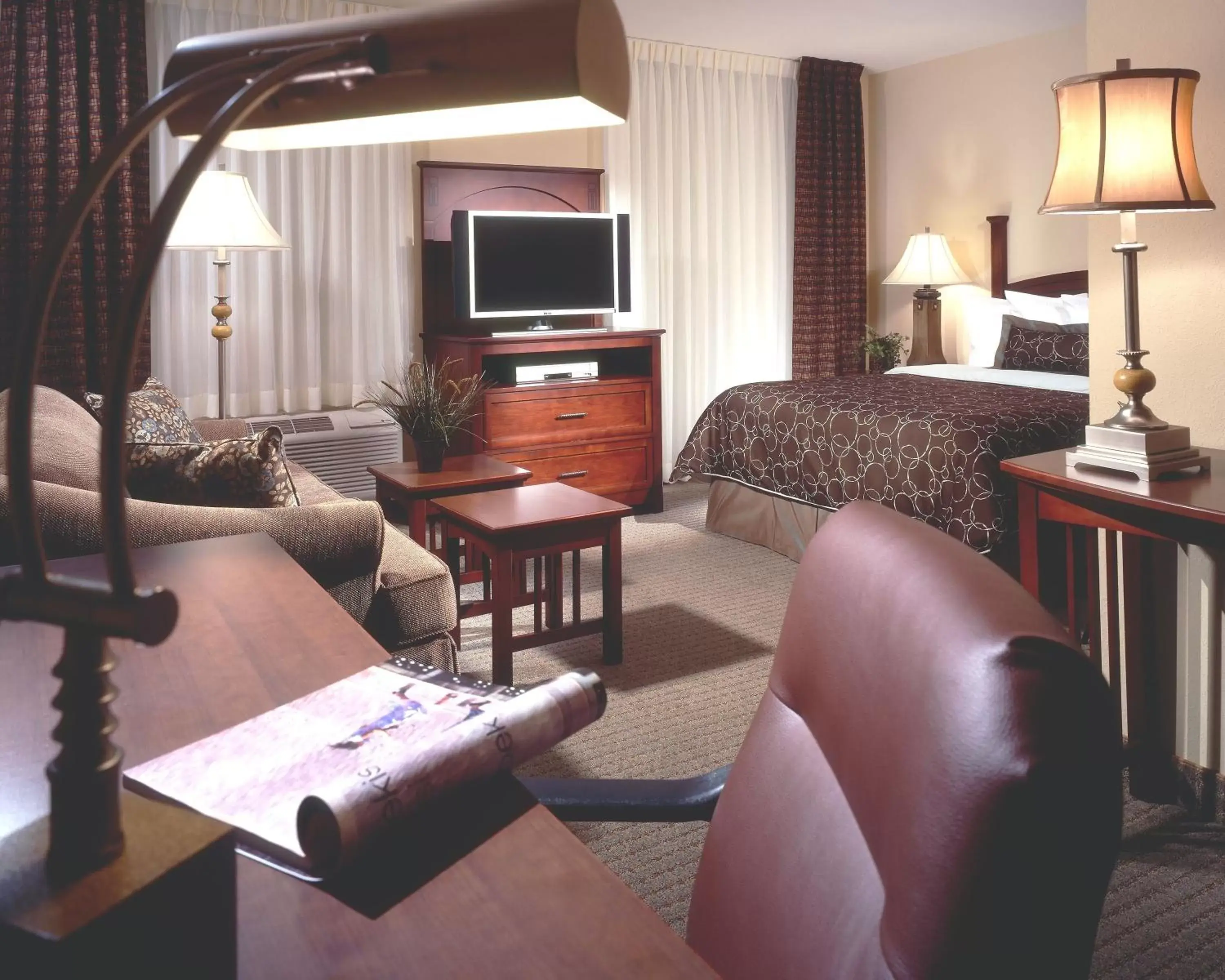 Bedroom, Seating Area in Staybridge Suites Milwaukee Airport South, an IHG Hotel