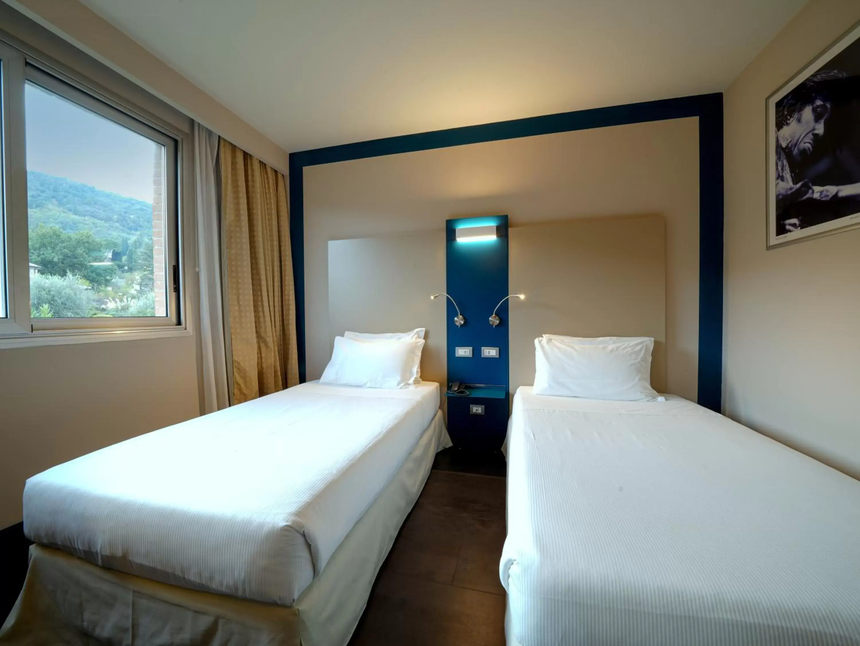 Bed in Hotel La Meridiana