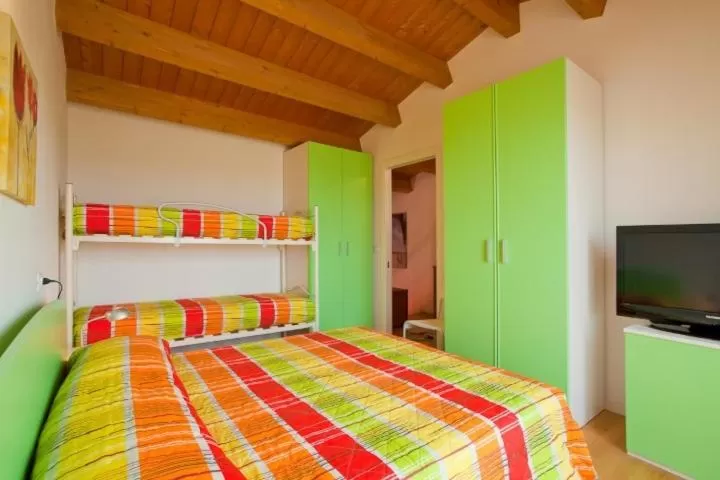 Bed in Villaggio dei Fiori Apart- Hotel 3 Stars - Family Resort