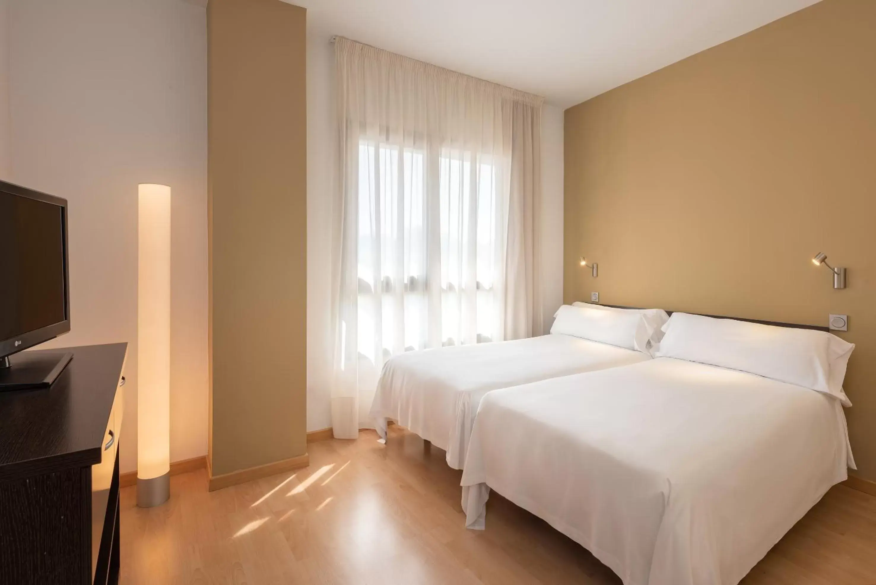 Photo of the whole room, Bed in Madrid Airport Suites, Affiliated by Meliá