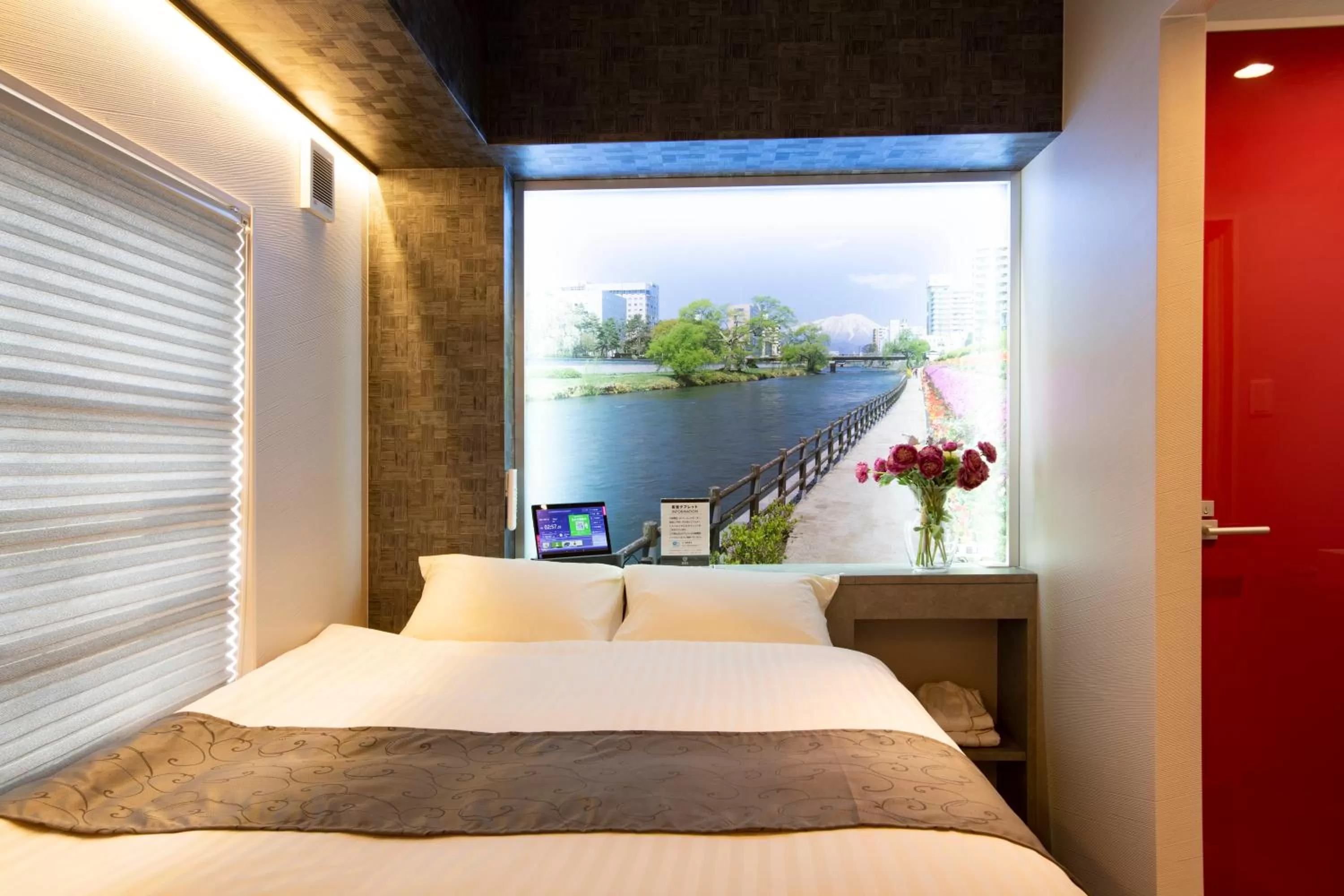 Bed in Hotel Xcell Hiroshima Nagarekawa