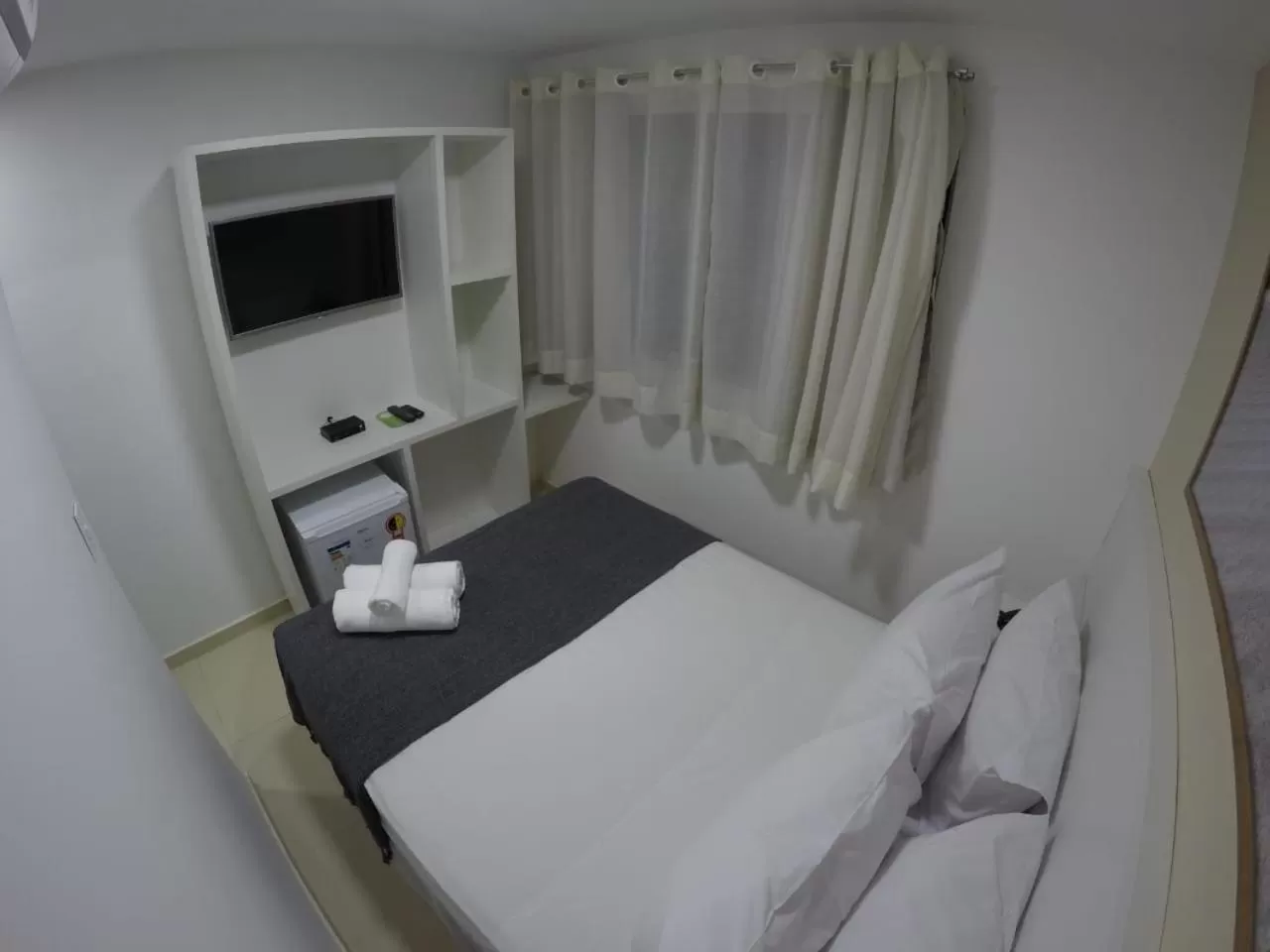 Bed in Pousada Kanoas