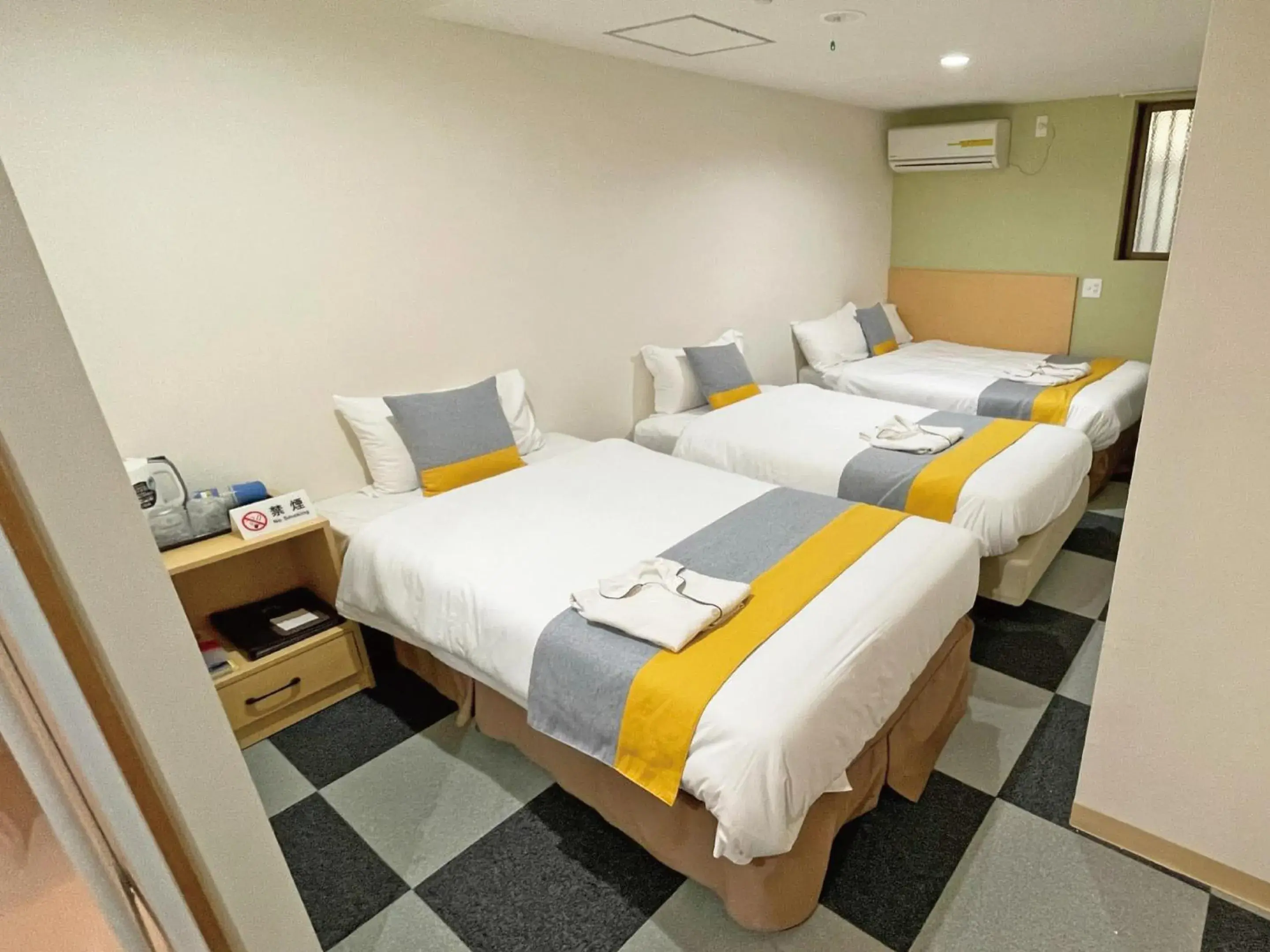 Bed in Victoria Hotel Naha