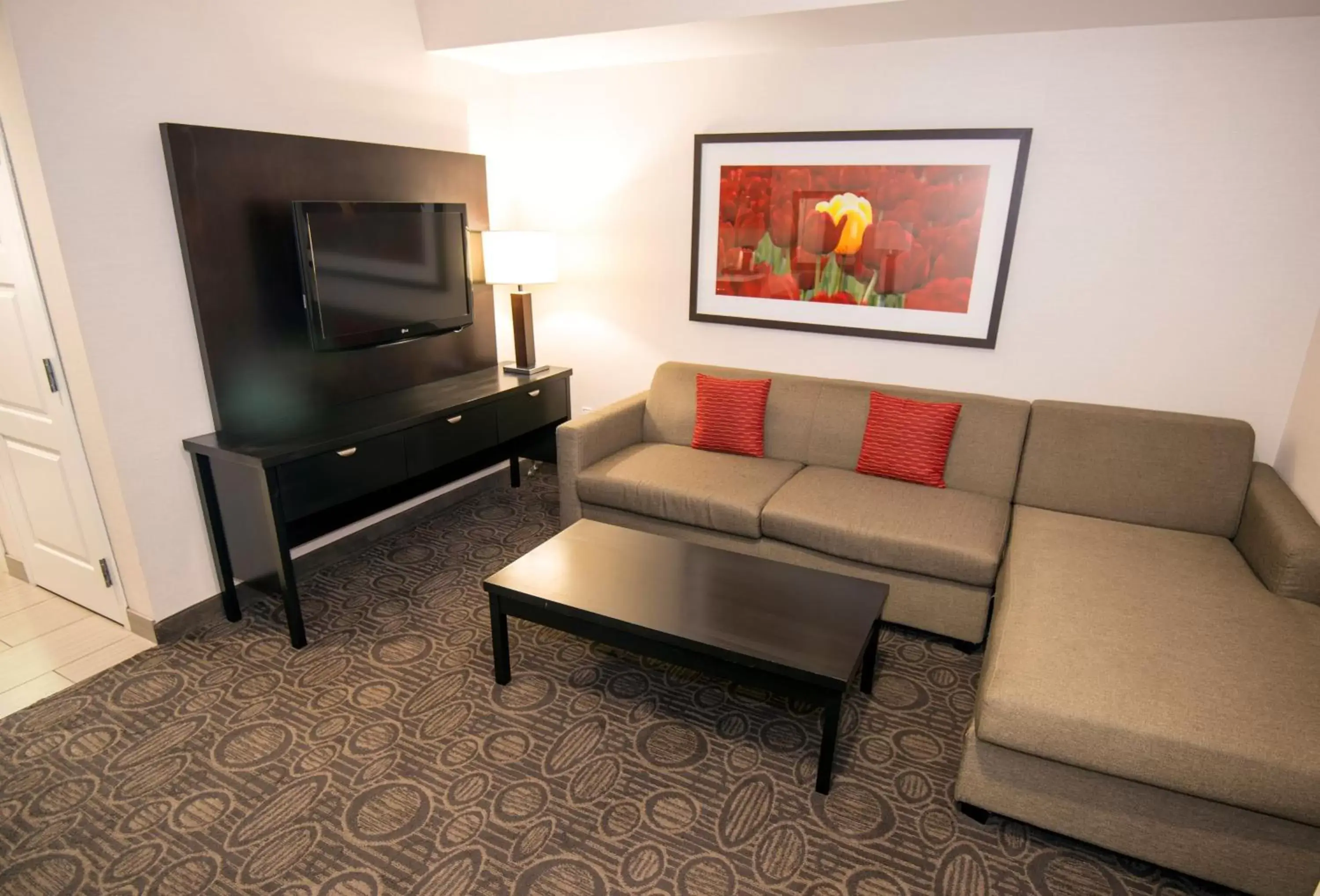 Photo of the whole room, TV/Entertainment Center in Holiday Inn Hotel & Suites Red Deer, an IHG Hotel