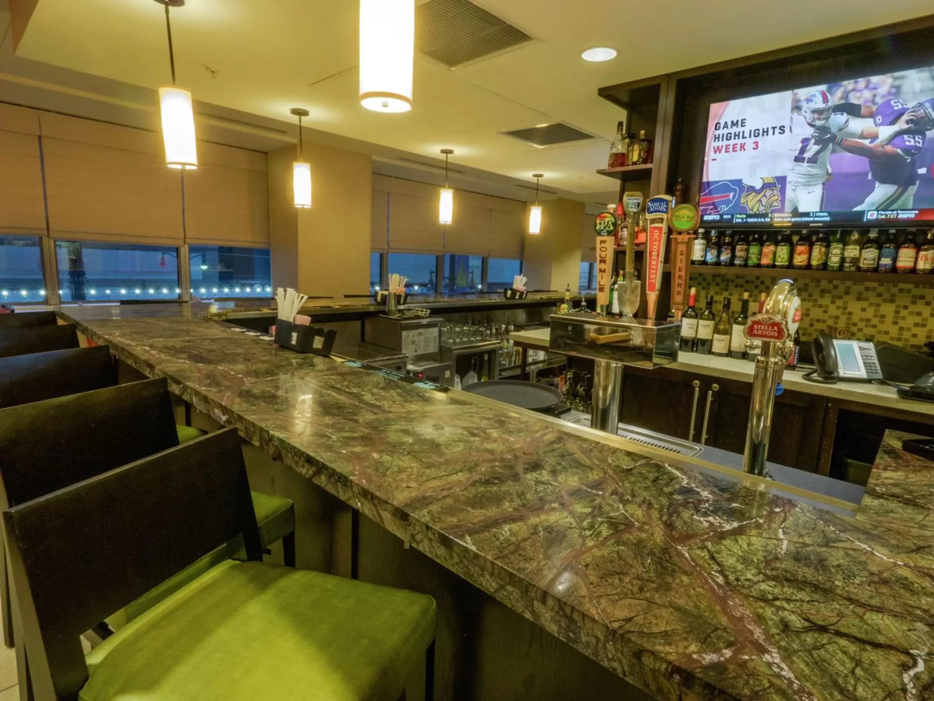 Lounge or bar in The Hilton Garden Inn Buffalo-Downtown Lounge or bar in The Hilton Garden Inn Buffalo-Downtown