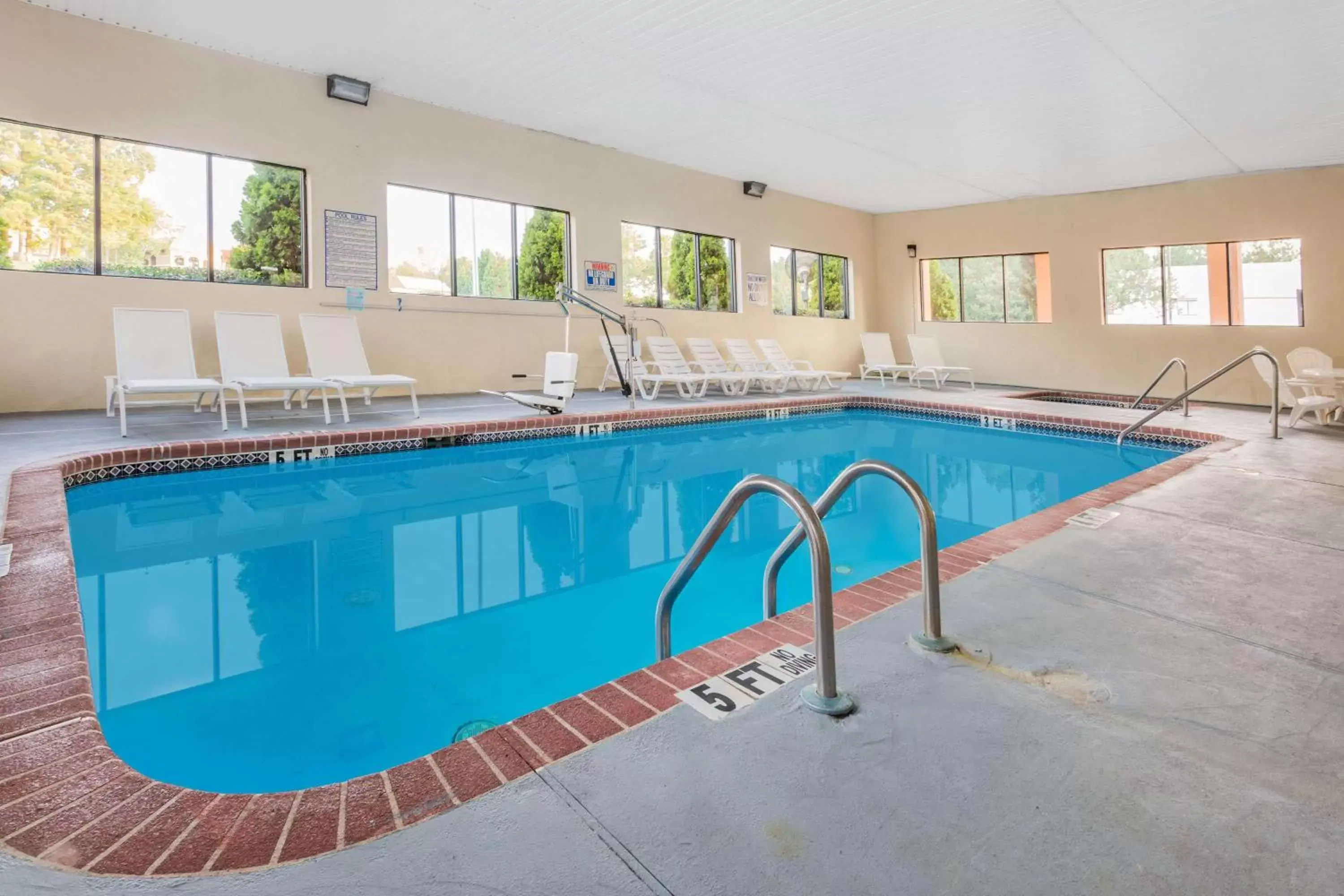 On site, Swimming Pool in Days Inn & Suites by Wyndham Peachtree Corners Norcross