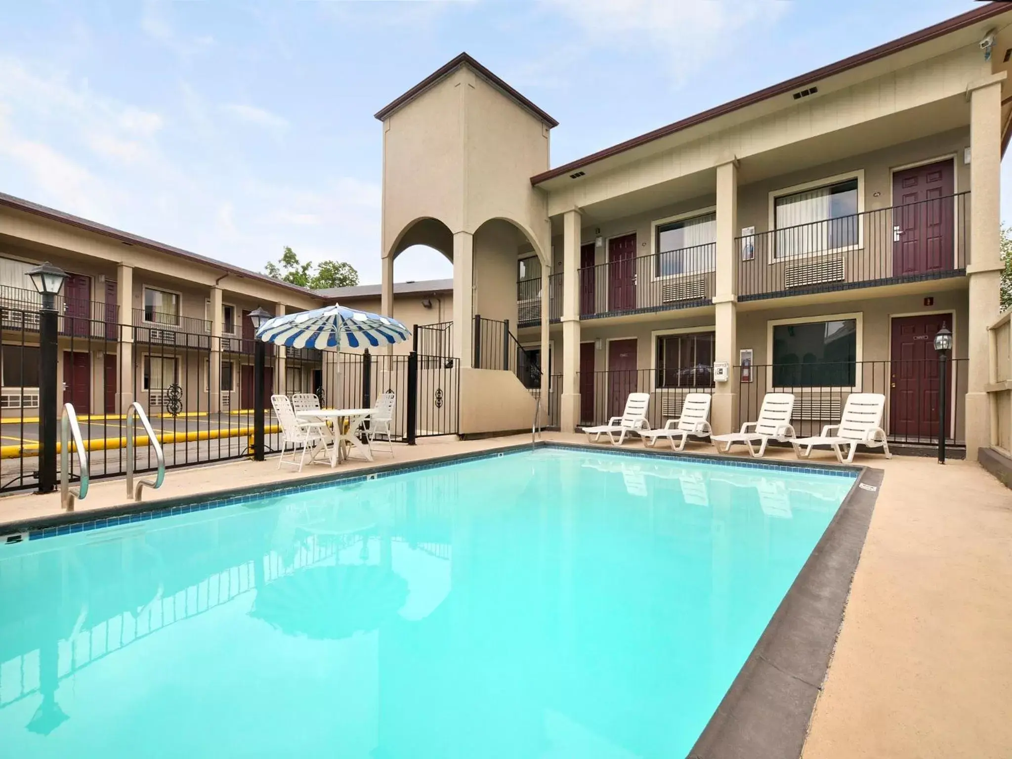 Property building, Swimming Pool in Super 8 by Wyndham San Antonio Downtown / Museum Reach