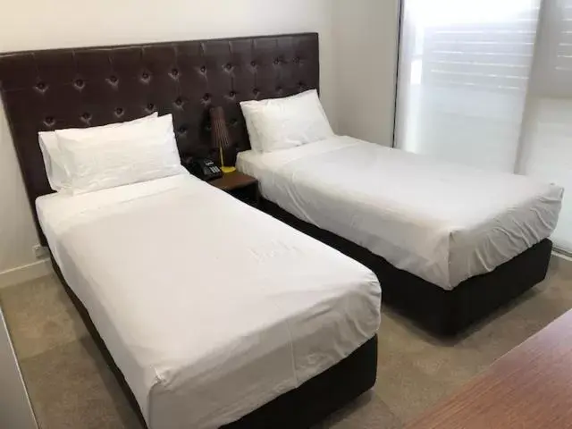 Bed in Whitehorse Apartments Hotel