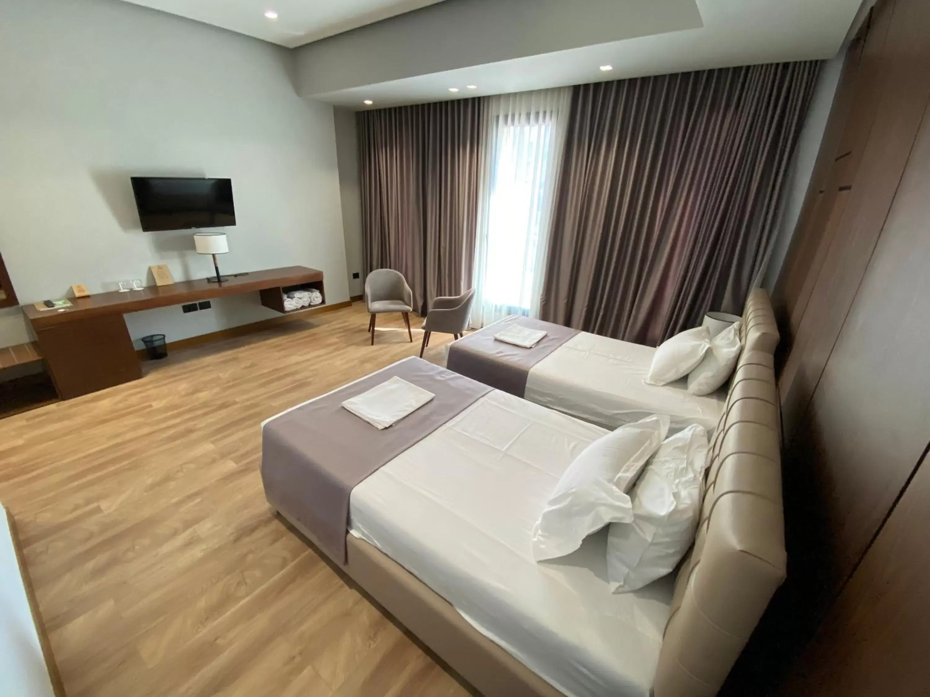 Photo of the whole room, TV/Entertainment Center in Portik Hotel