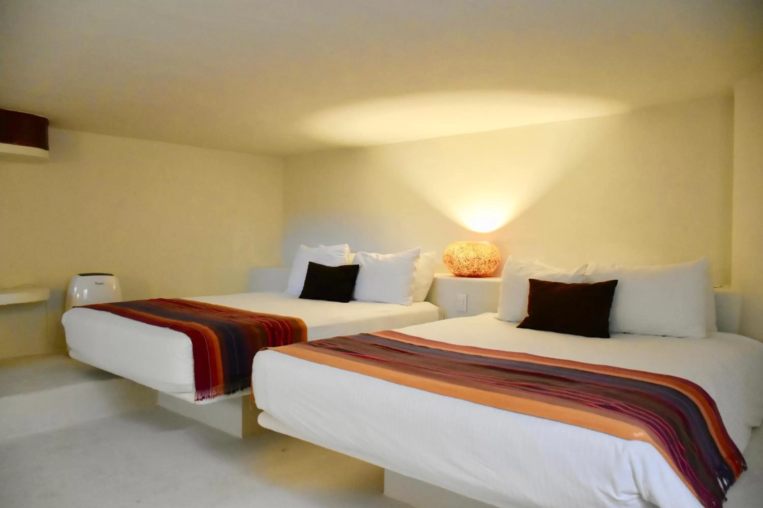 Bed in Playa Palms Beach Hotel