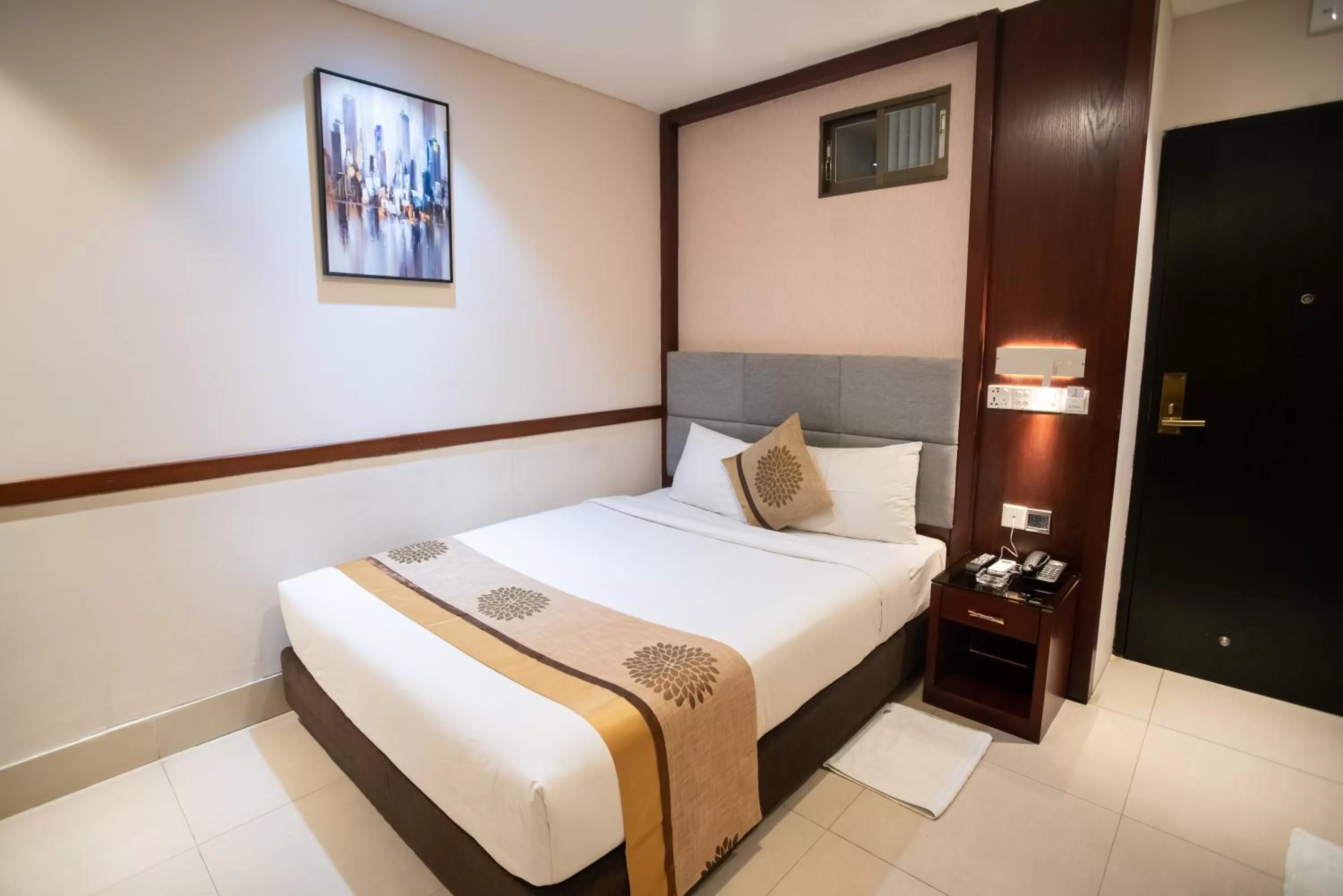 Bed in Jatra Hotel Grand Royal