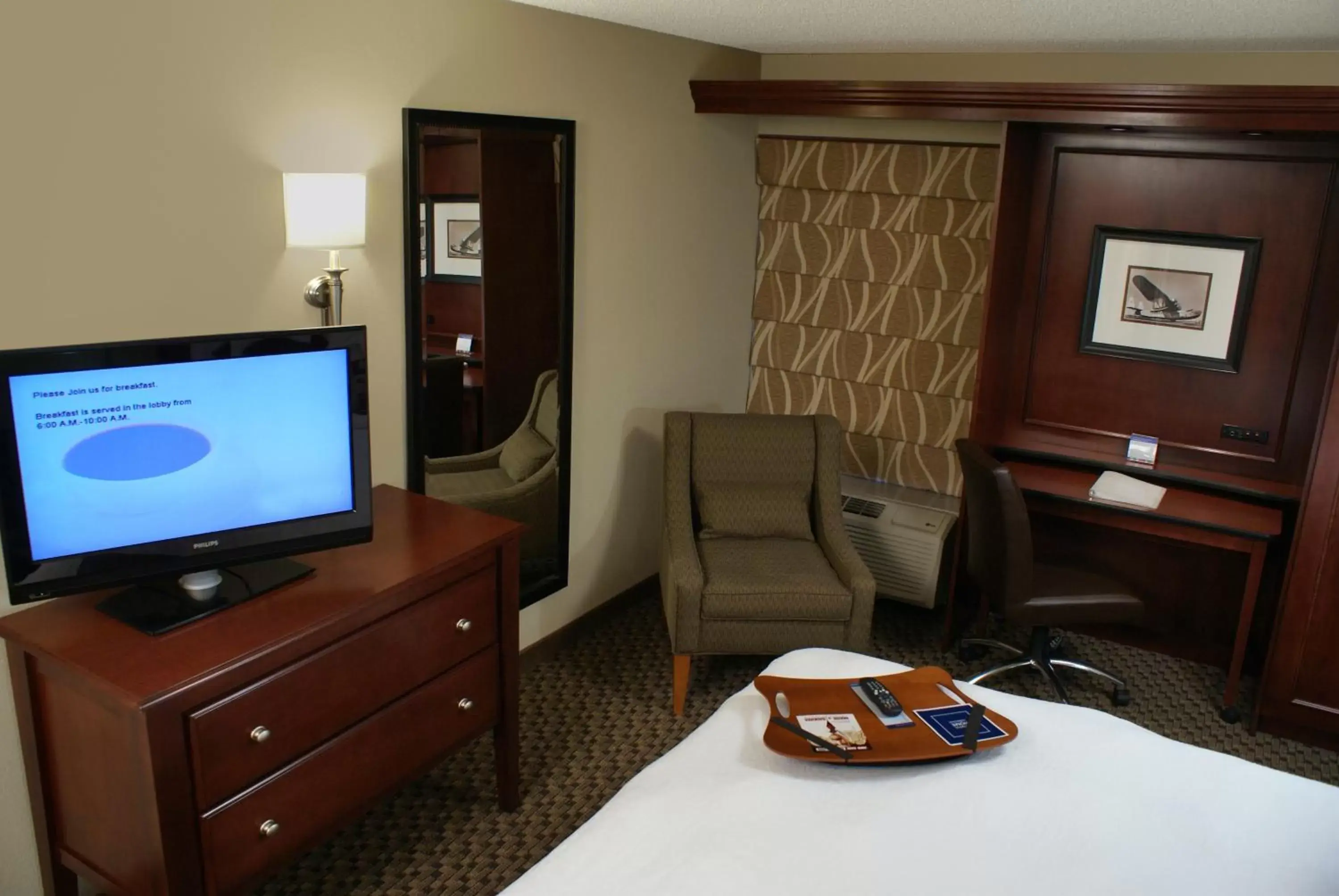 Photo of the whole room, TV/Entertainment Center in The Addison Hotel SureStay Collection by Best Western