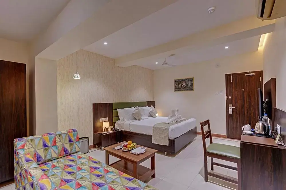 Living room, Bed in Guruprerna Beacon Resort, Dwarka
