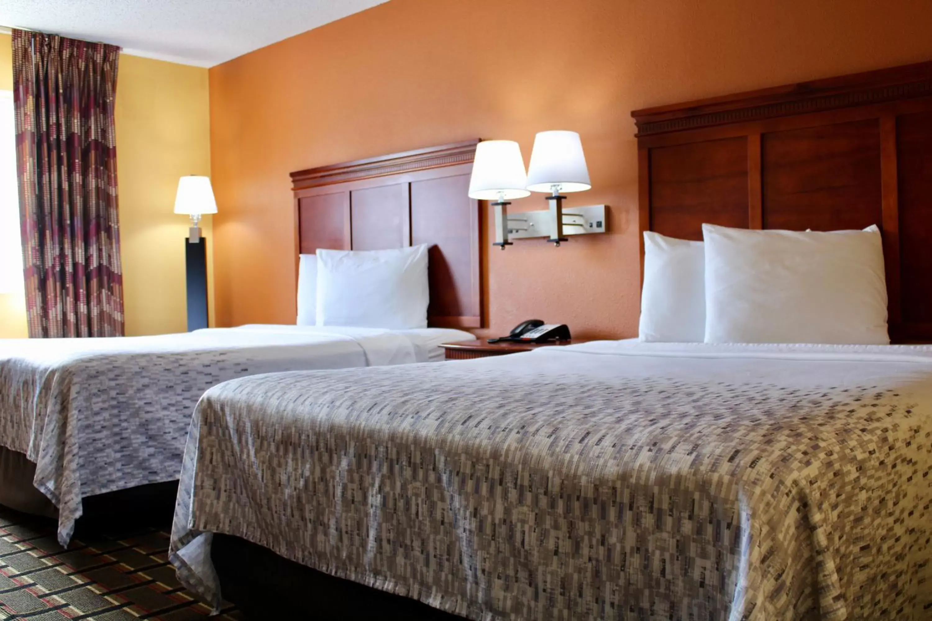 Bed in HomeTown Inn & Suites