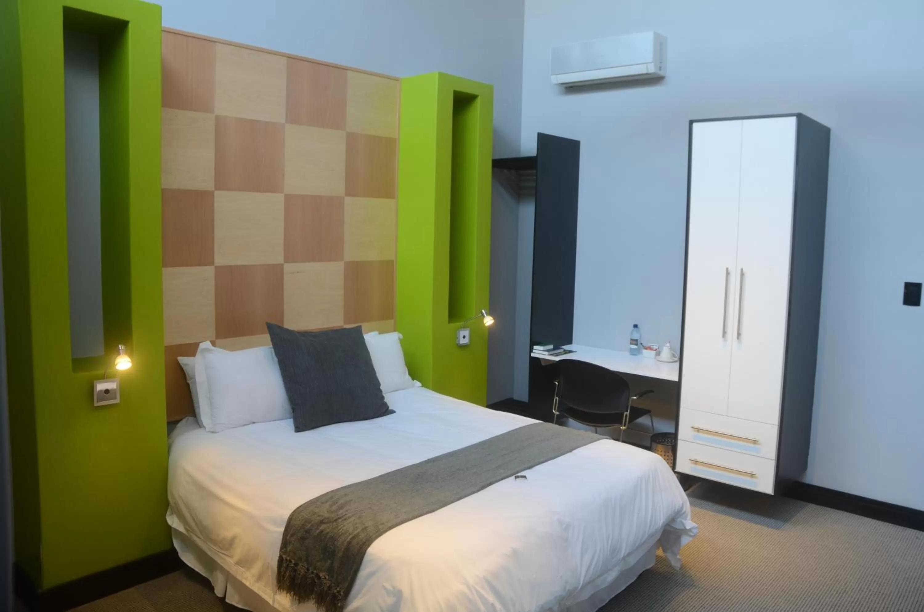 Bed in City Living Boutique Hotel