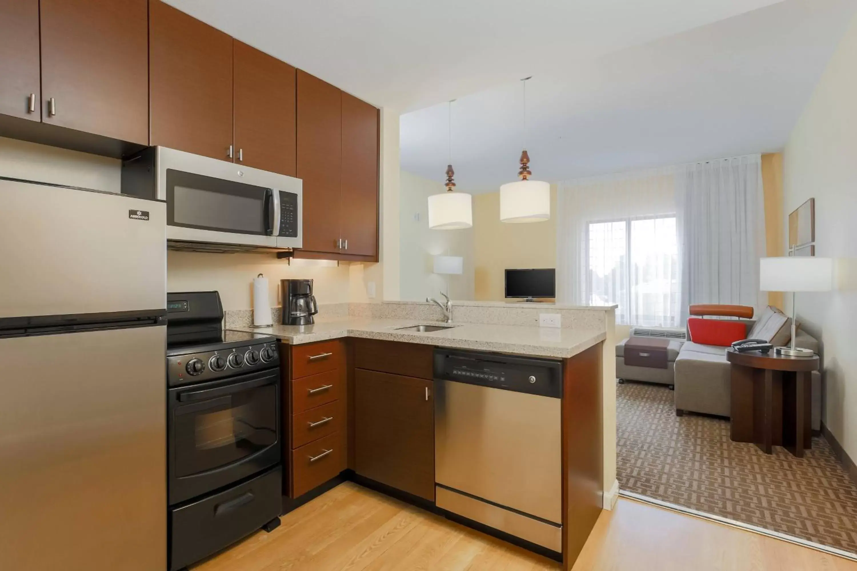 Bedroom, Kitchen/Kitchenette in TownePlace Suites by Marriott Cheyenne Southwest/Downtown Area