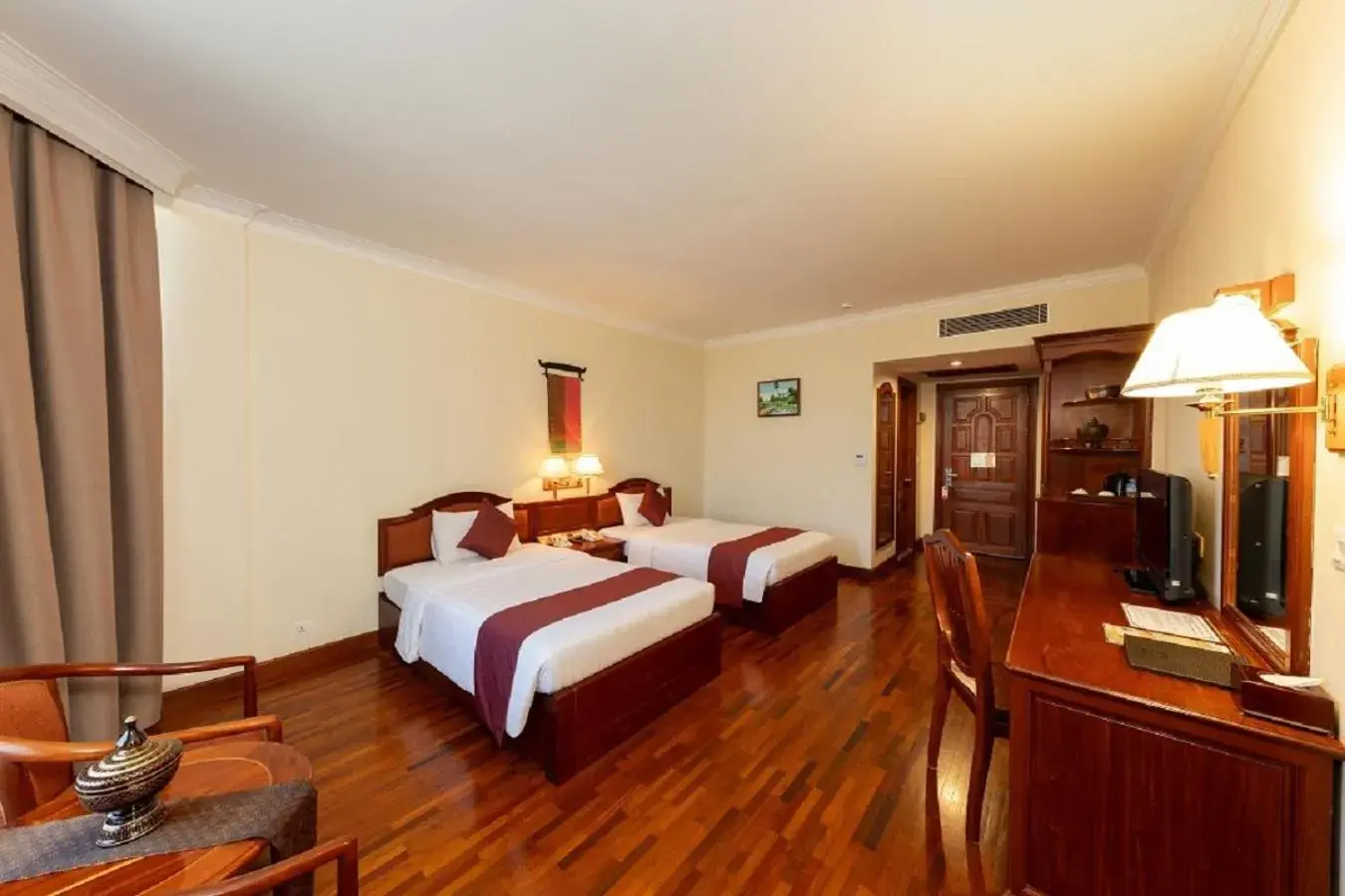 Bed in Khemara Angkor Hotel & Spa