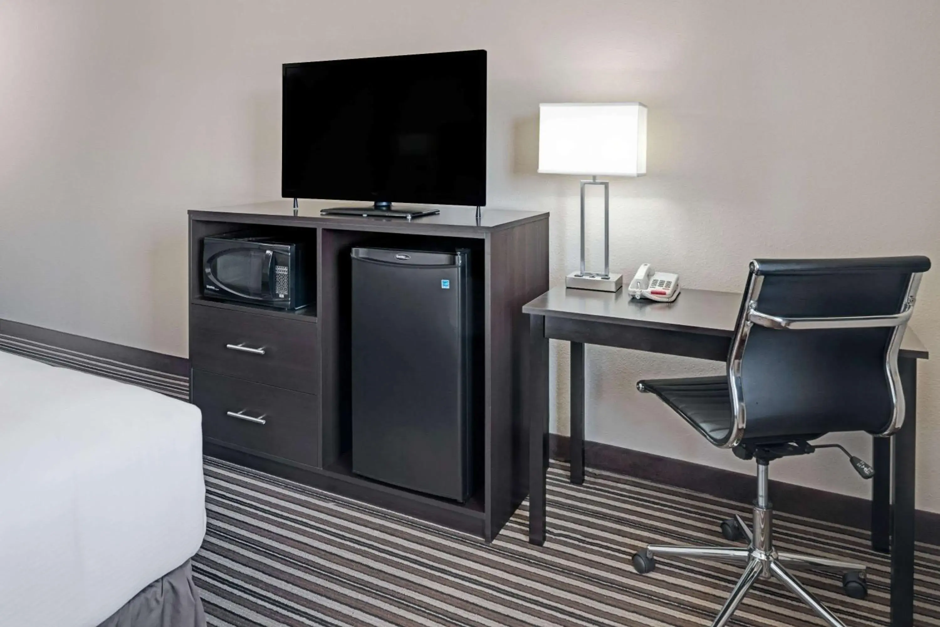 Photo of the whole room, TV/Entertainment Center in Super 8 by Wyndham Omaha I-80 West