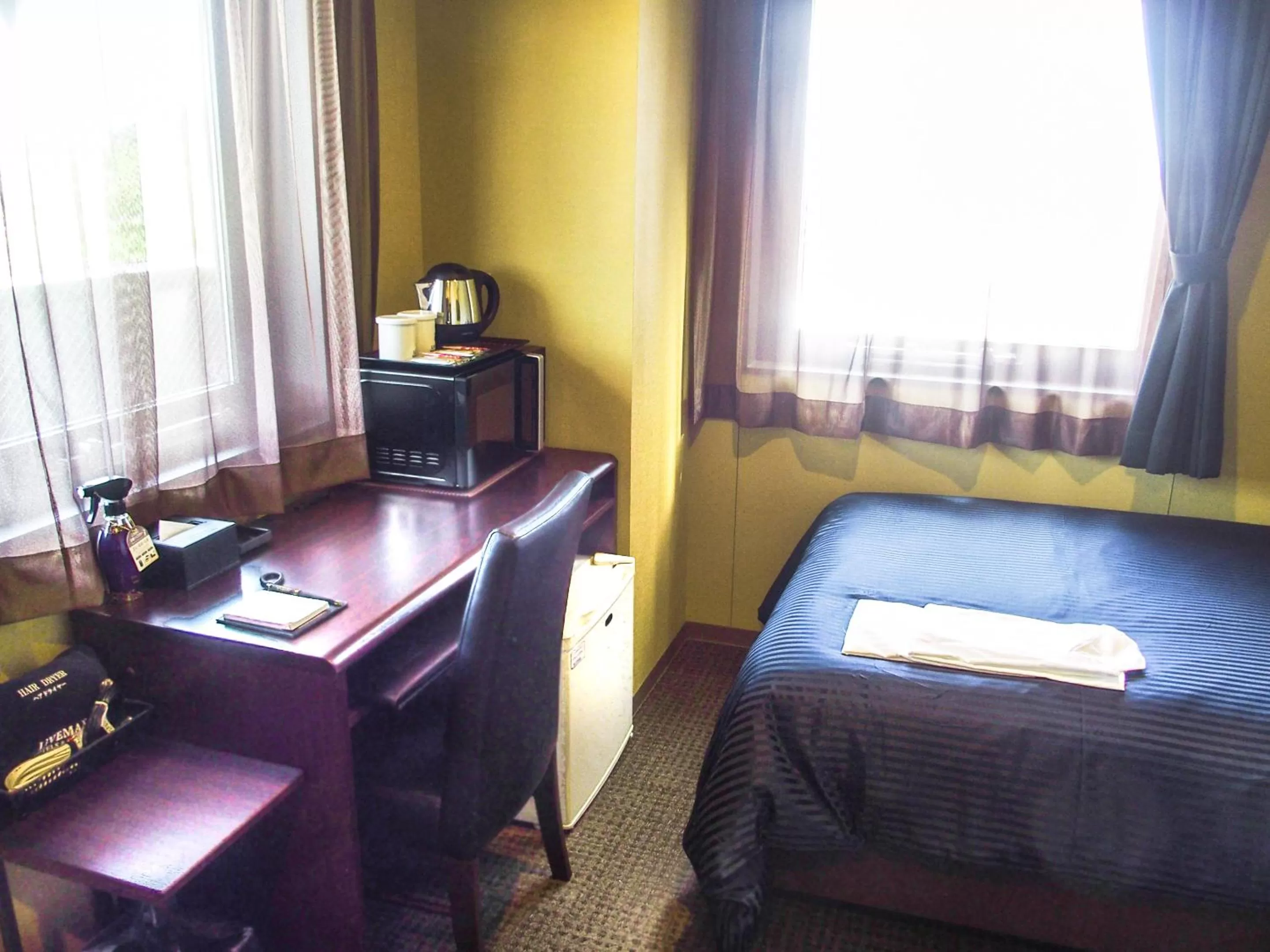 Bed in HOTEL LiVEMAX Fukuyama Ekimae