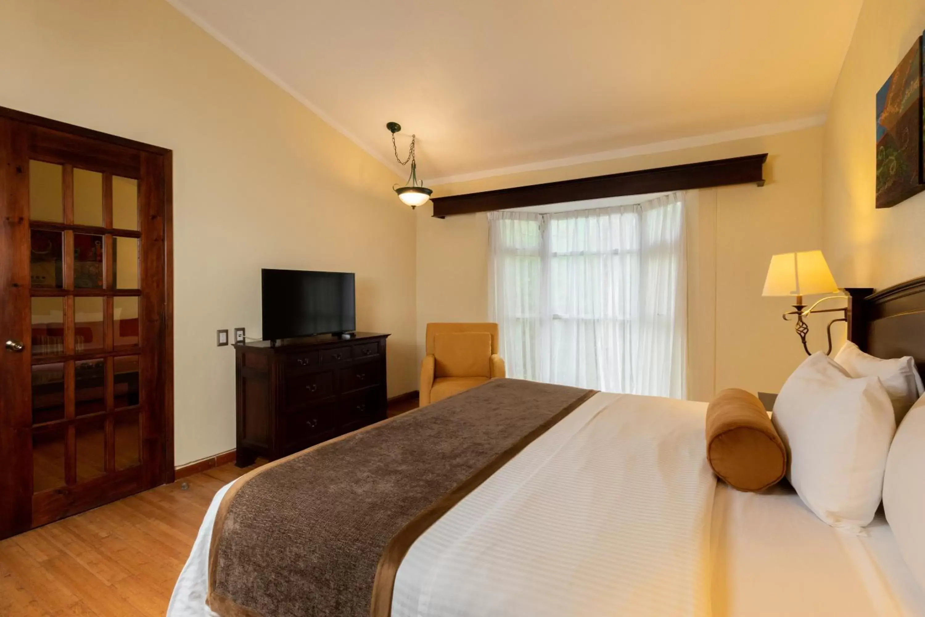 Communal lounge/ TV room, Bed in Hoteles Villa Mercedes San Cristobal