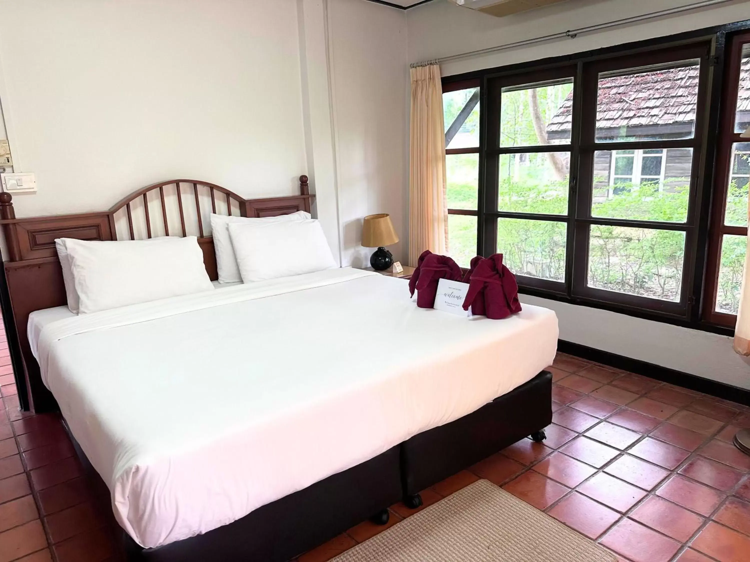 Bed in The Legacy River Kwai Resort