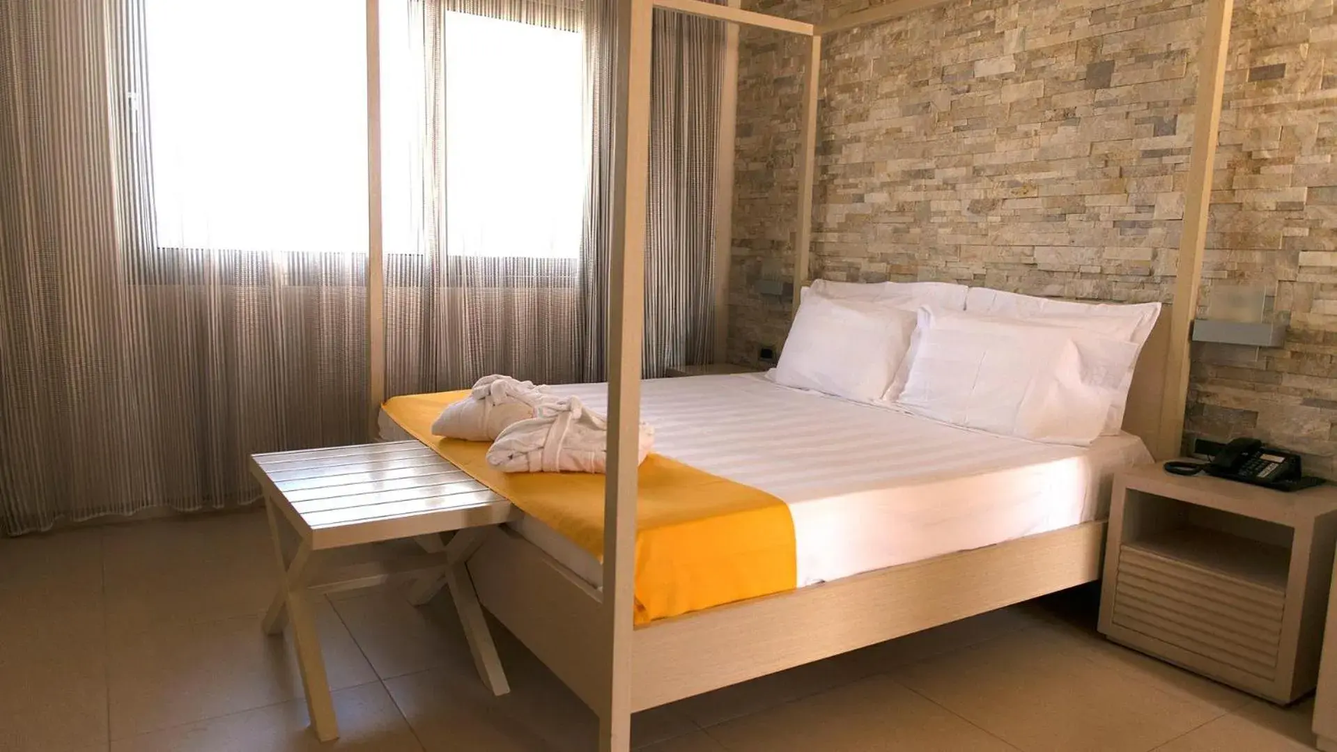 Bedroom, Bed in Port Royal Villas and Spa - Adults Only