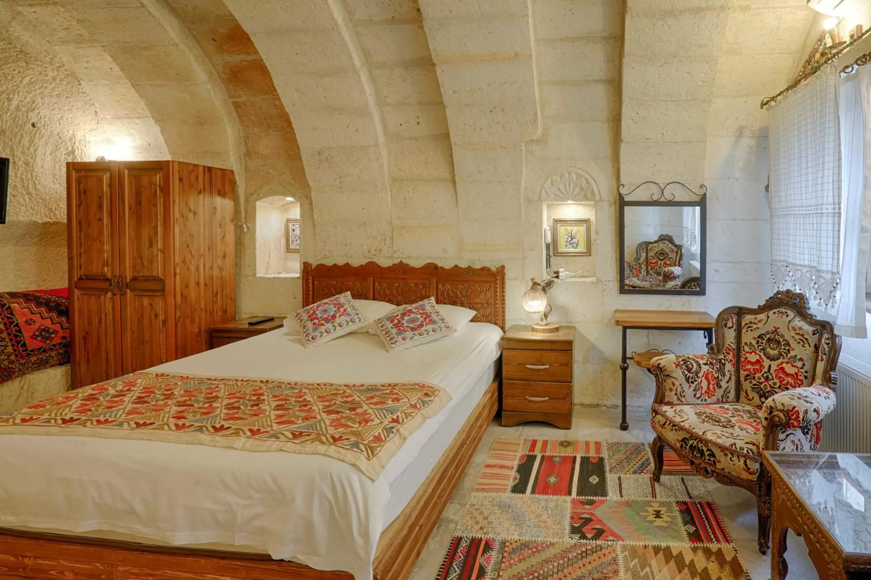 Bed in Tulip Cave Suites