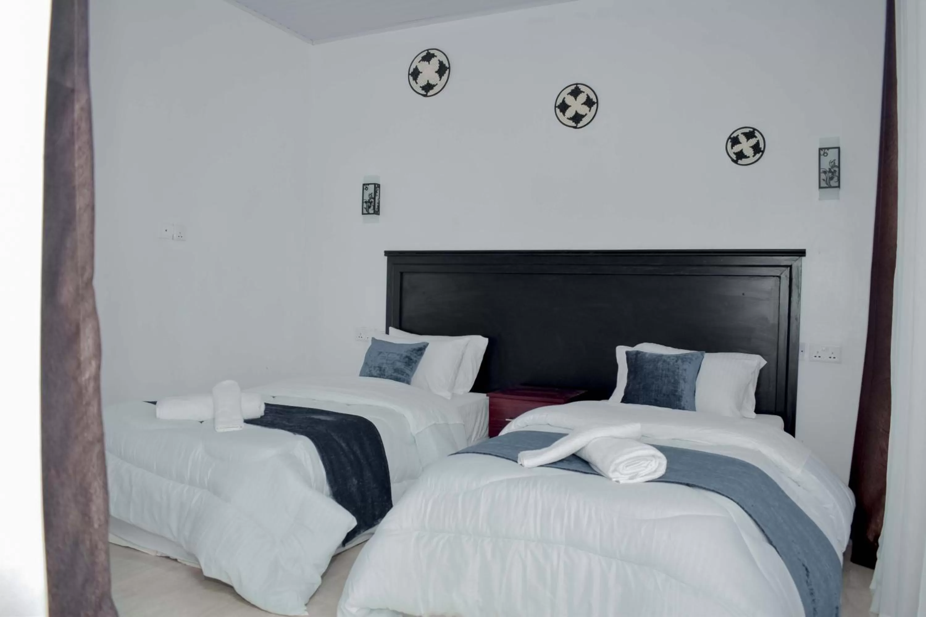 Bed in INZOZI AFRICA HOUSE B&B-Gishushu