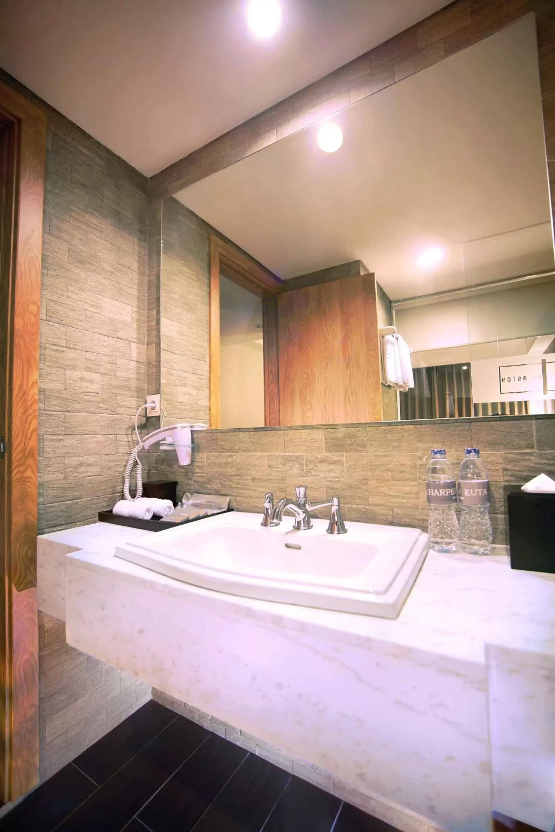 Bathroom in Harper Kuta Hotel by ASTON