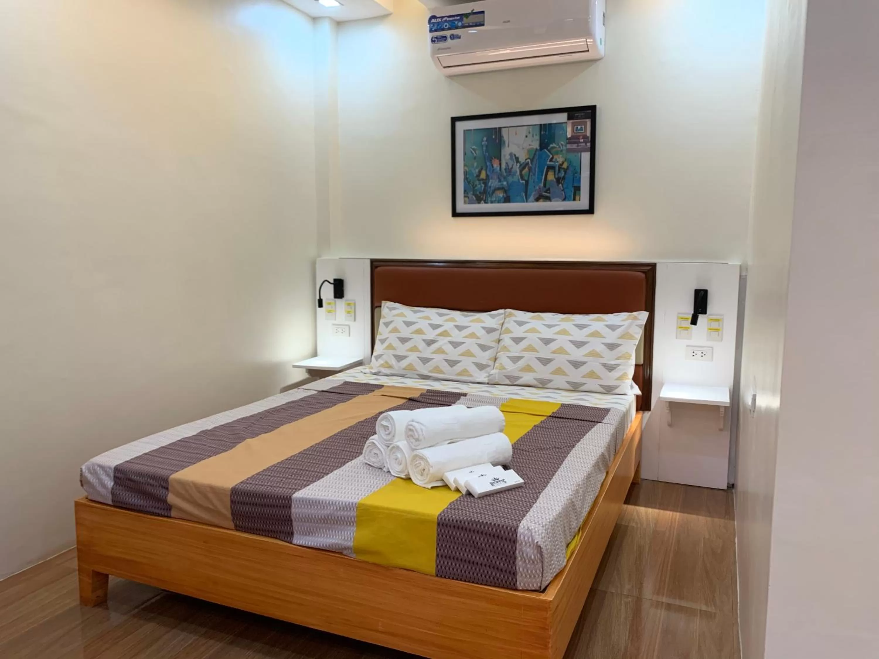 Bed in Rustic Crown Hotel