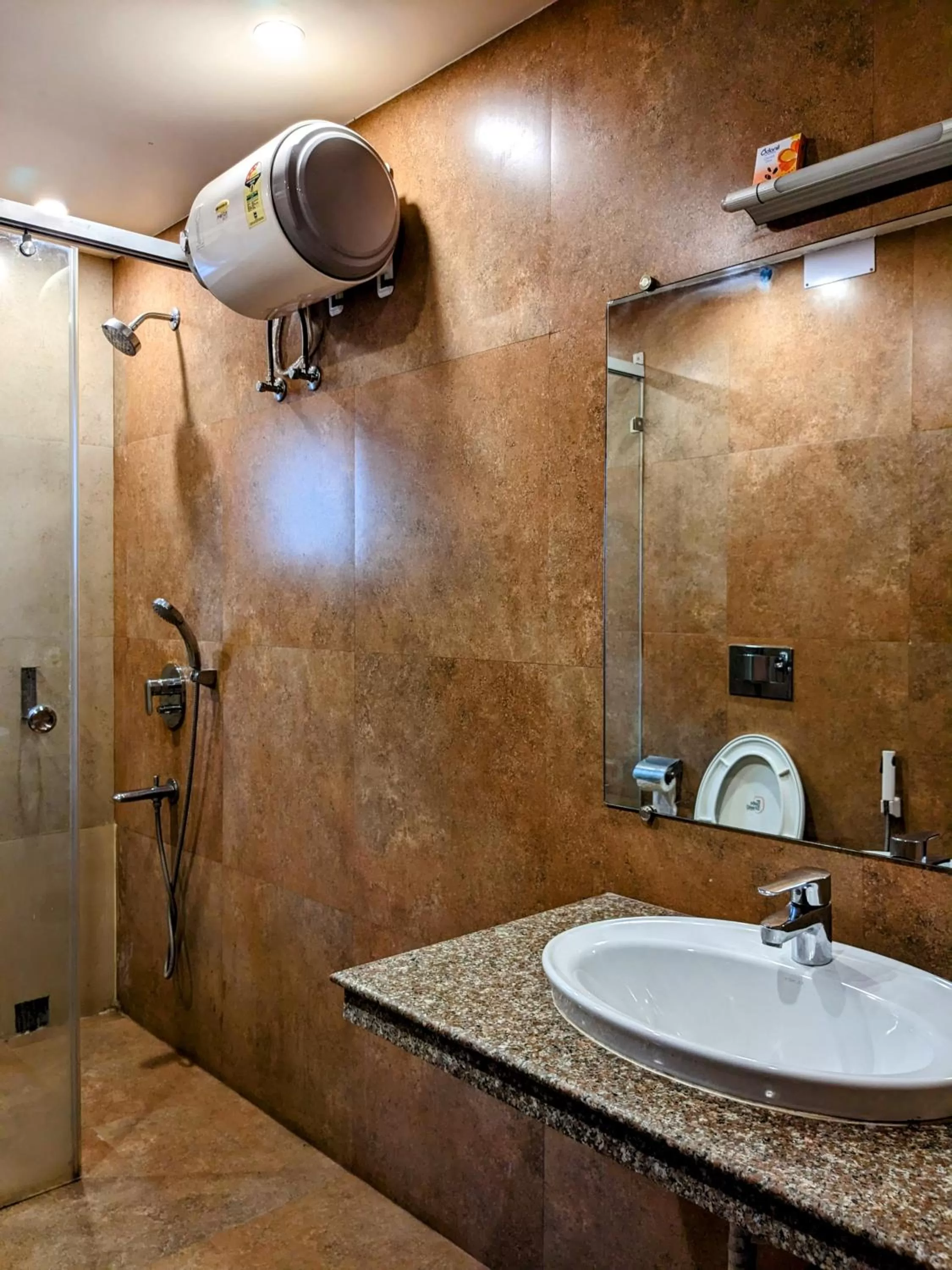Shower in The Aster Enclave Hotel