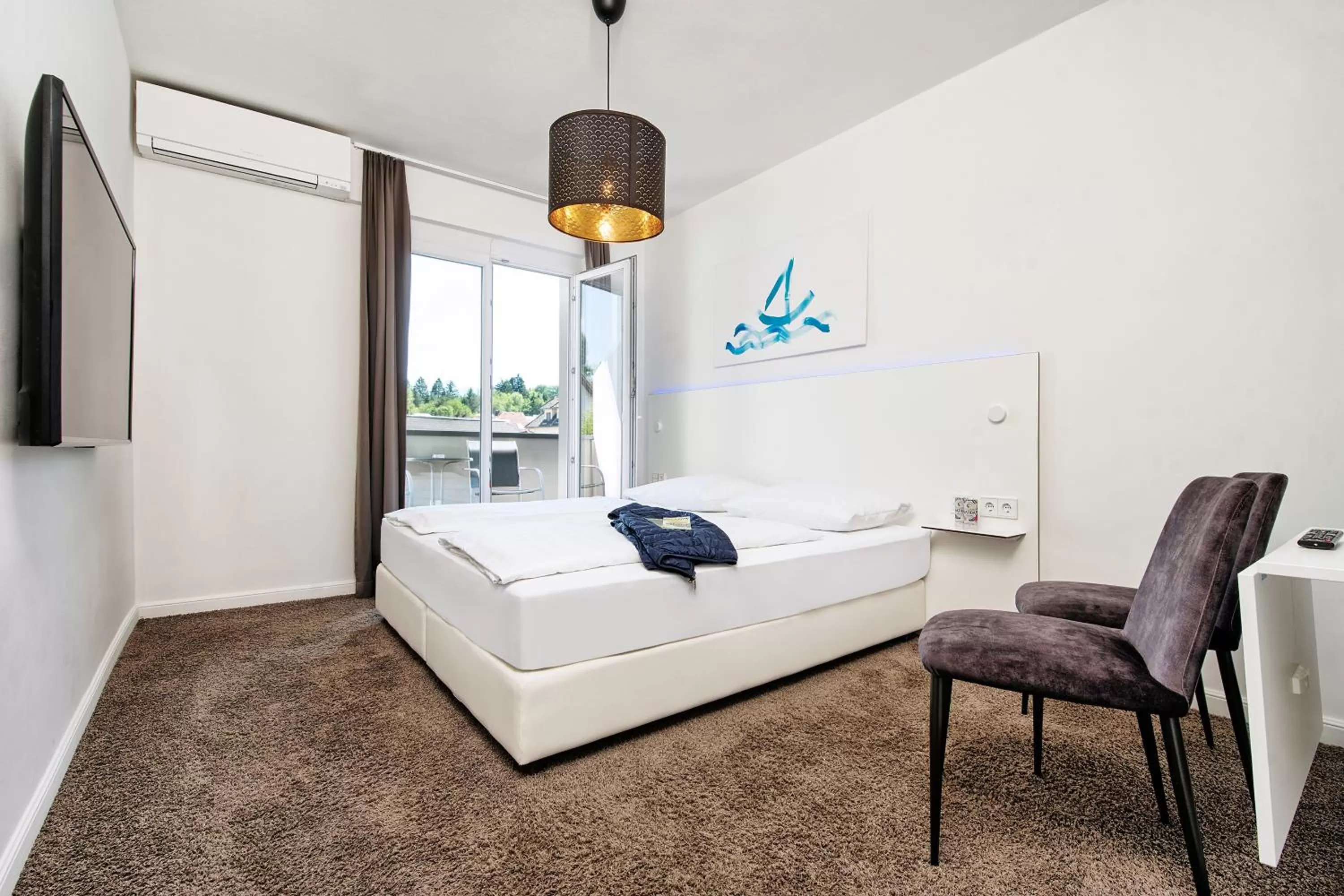 Photo of the whole room, Bed in Hotel Velden - 24 Checkin Zimmer im Zentrum