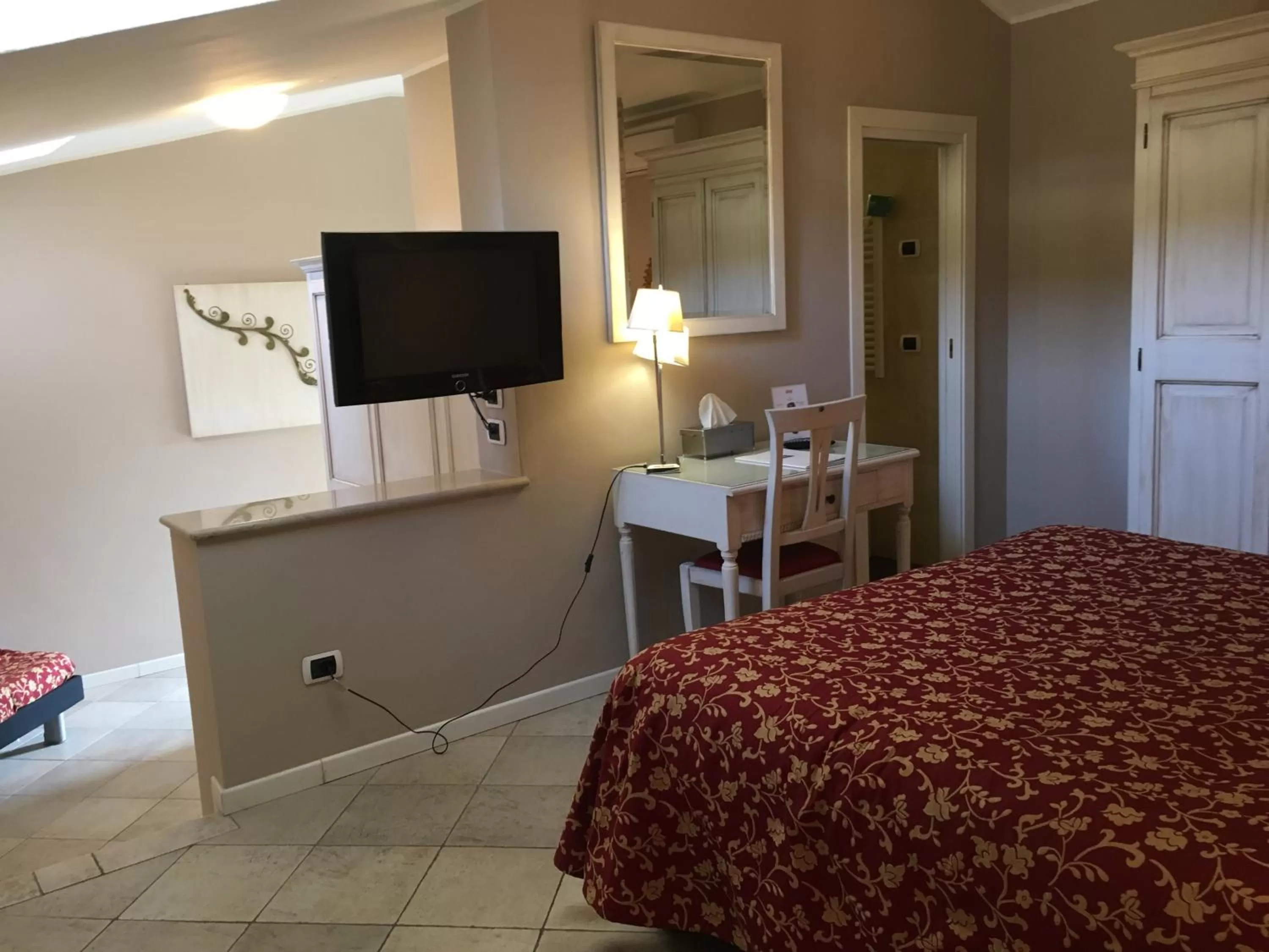 Decorative detail, Bed in Alessi Hotel Trattoria