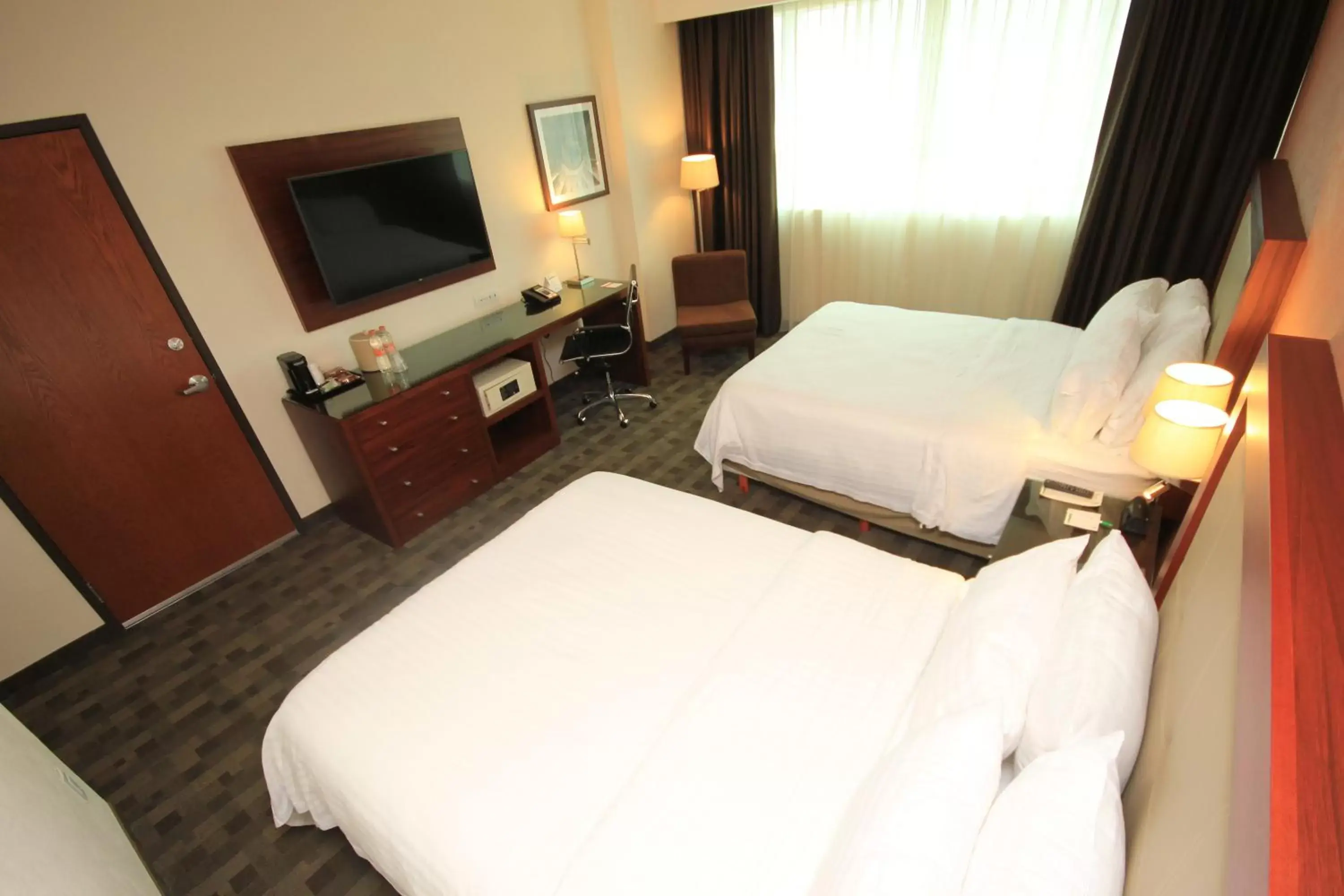 Photo of the whole room, Bed in Holiday Inn & Suites Plaza Mayor, an IHG Hotel