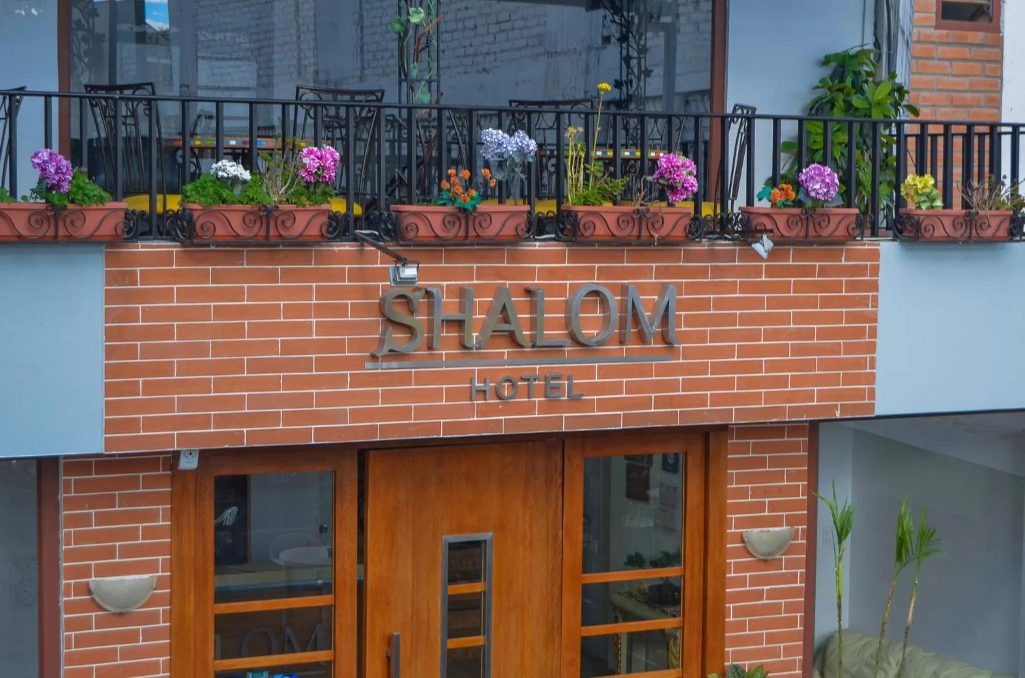 Property logo or sign in Hotel Shalom