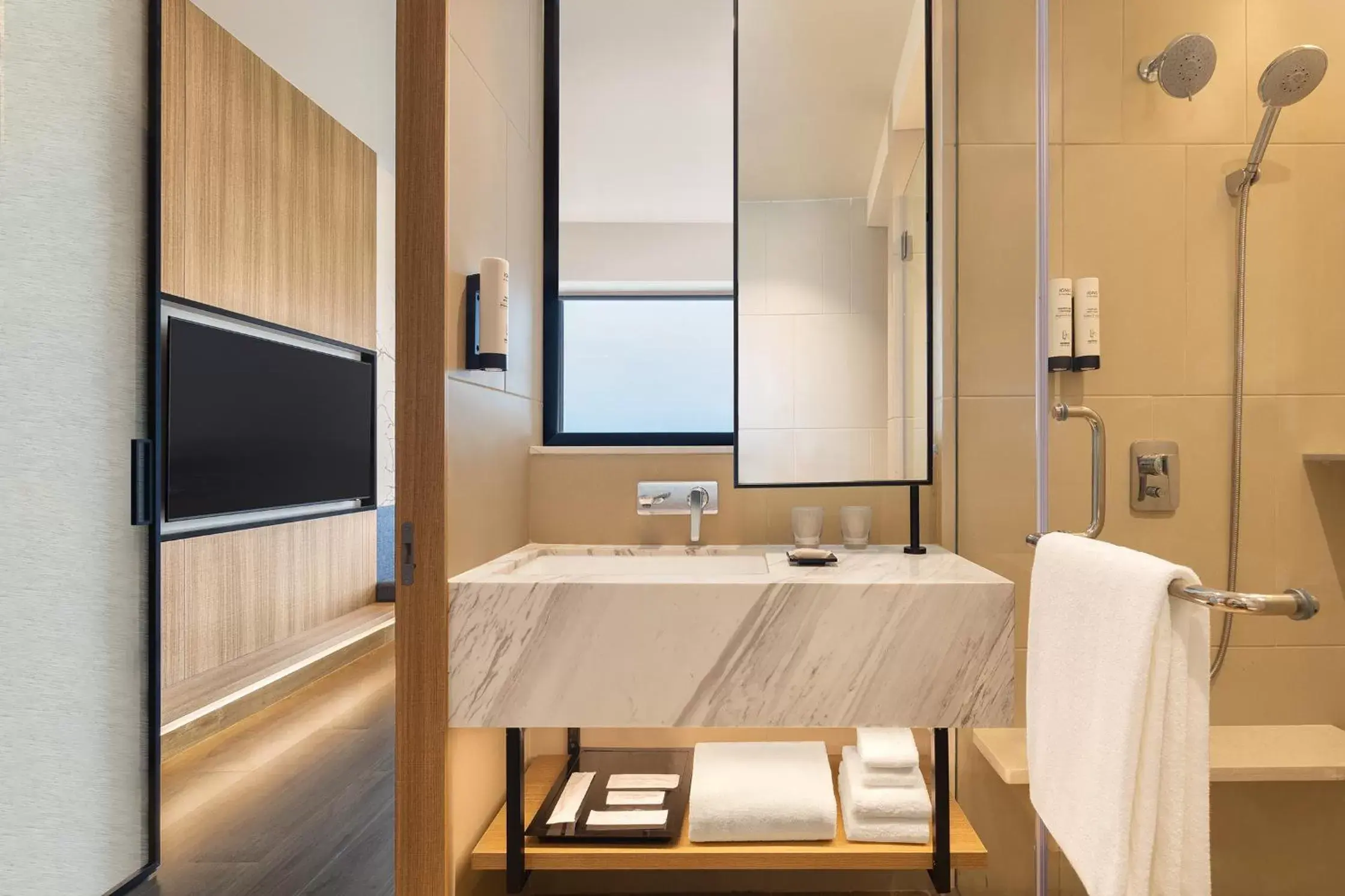 Bathroom, TV/Entertainment Center in Fairfield by Marriott Mumbai International Airport