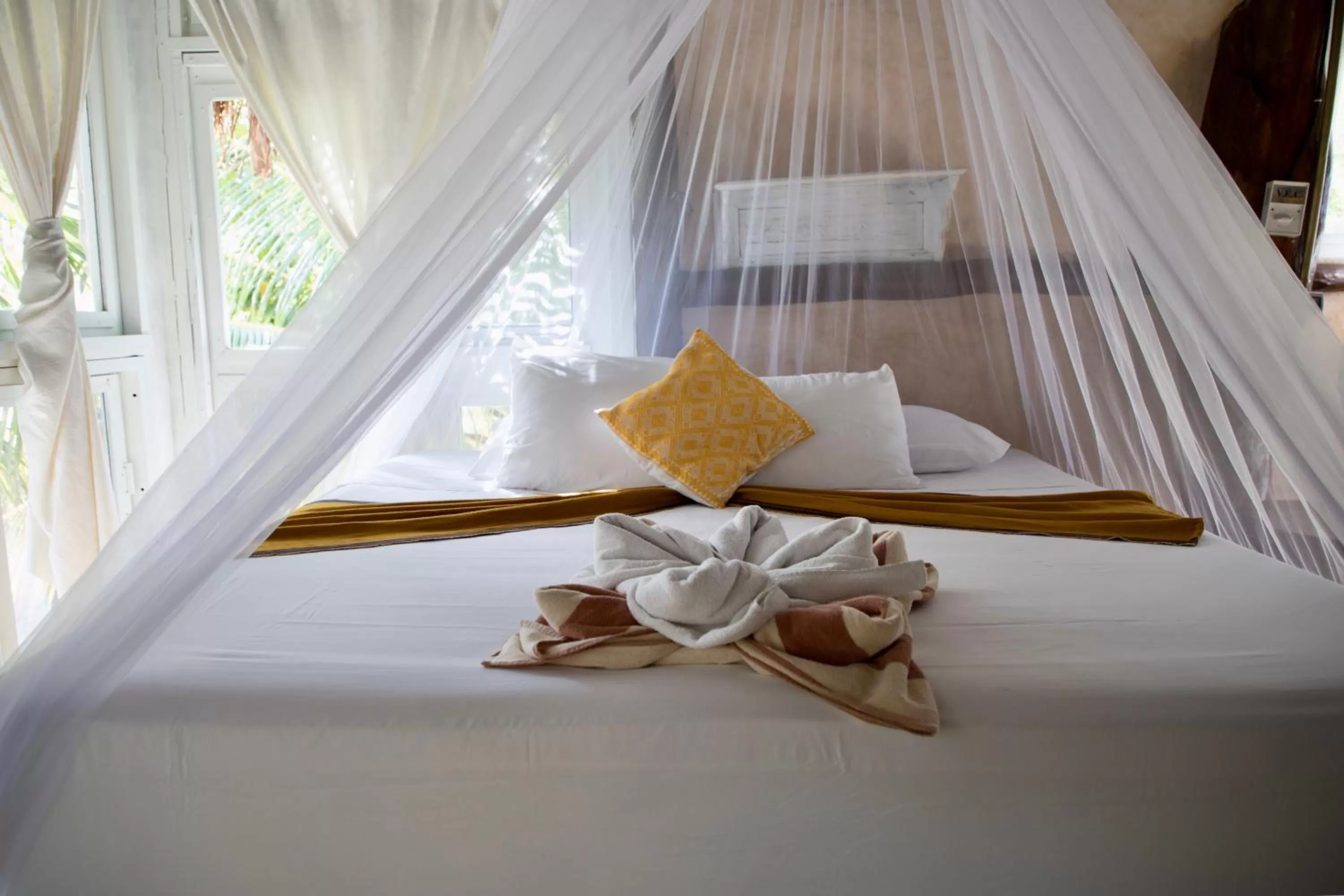 Bed in Posada Lamar Tulum Beach Front and Pool