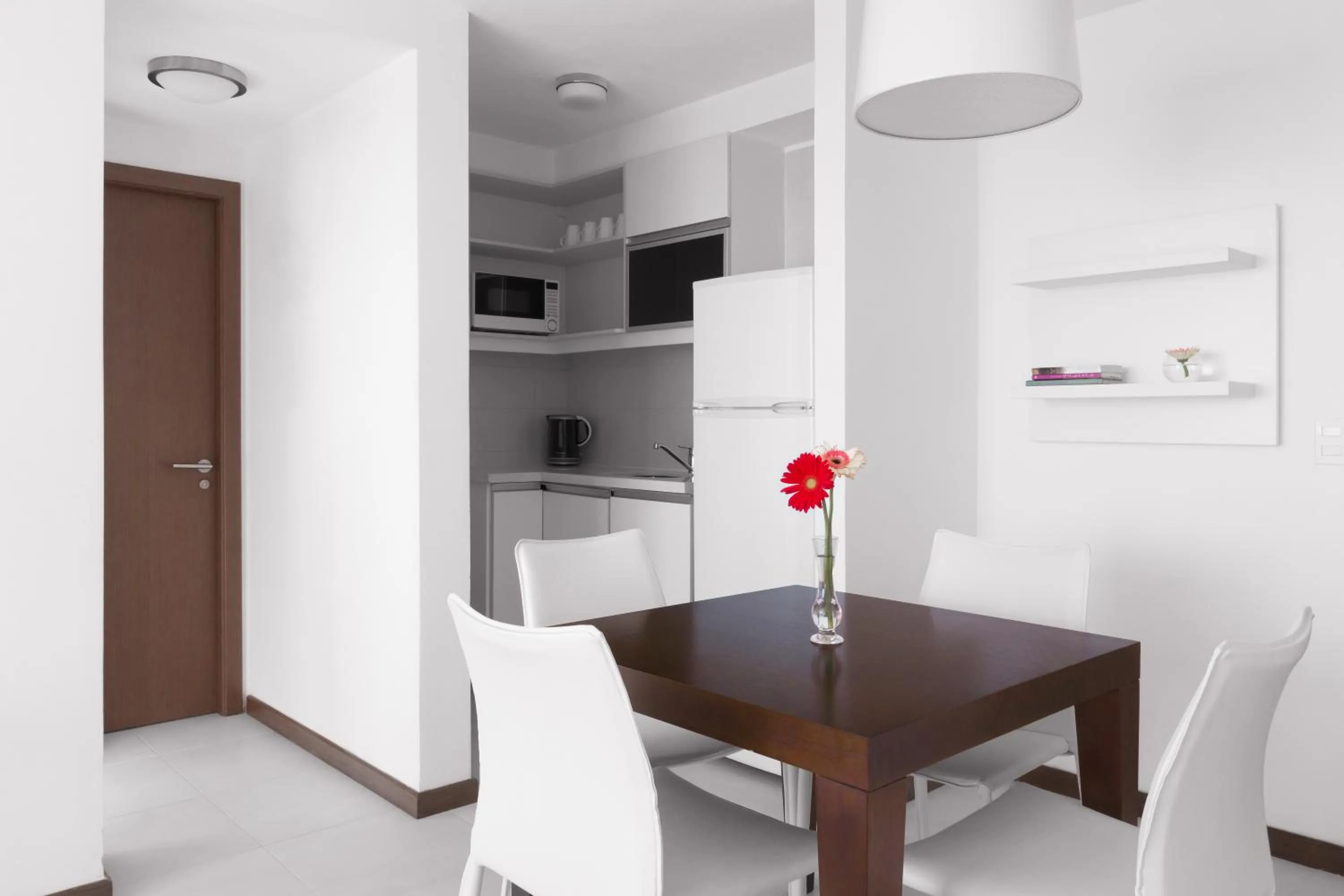Kitchen or kitchenette in Real Colonia Hotel & Suites